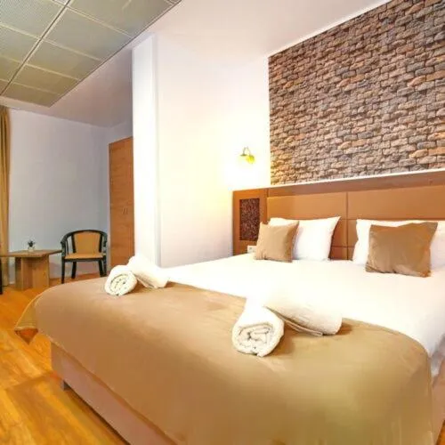 Bed in Sir Fundeni Hotel