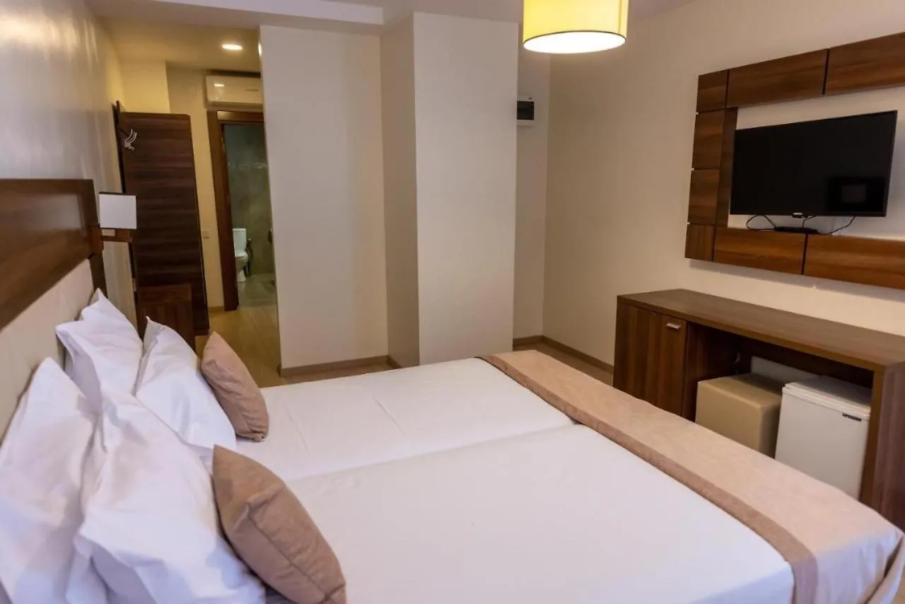 Bed in Sir Fundeni Hotel