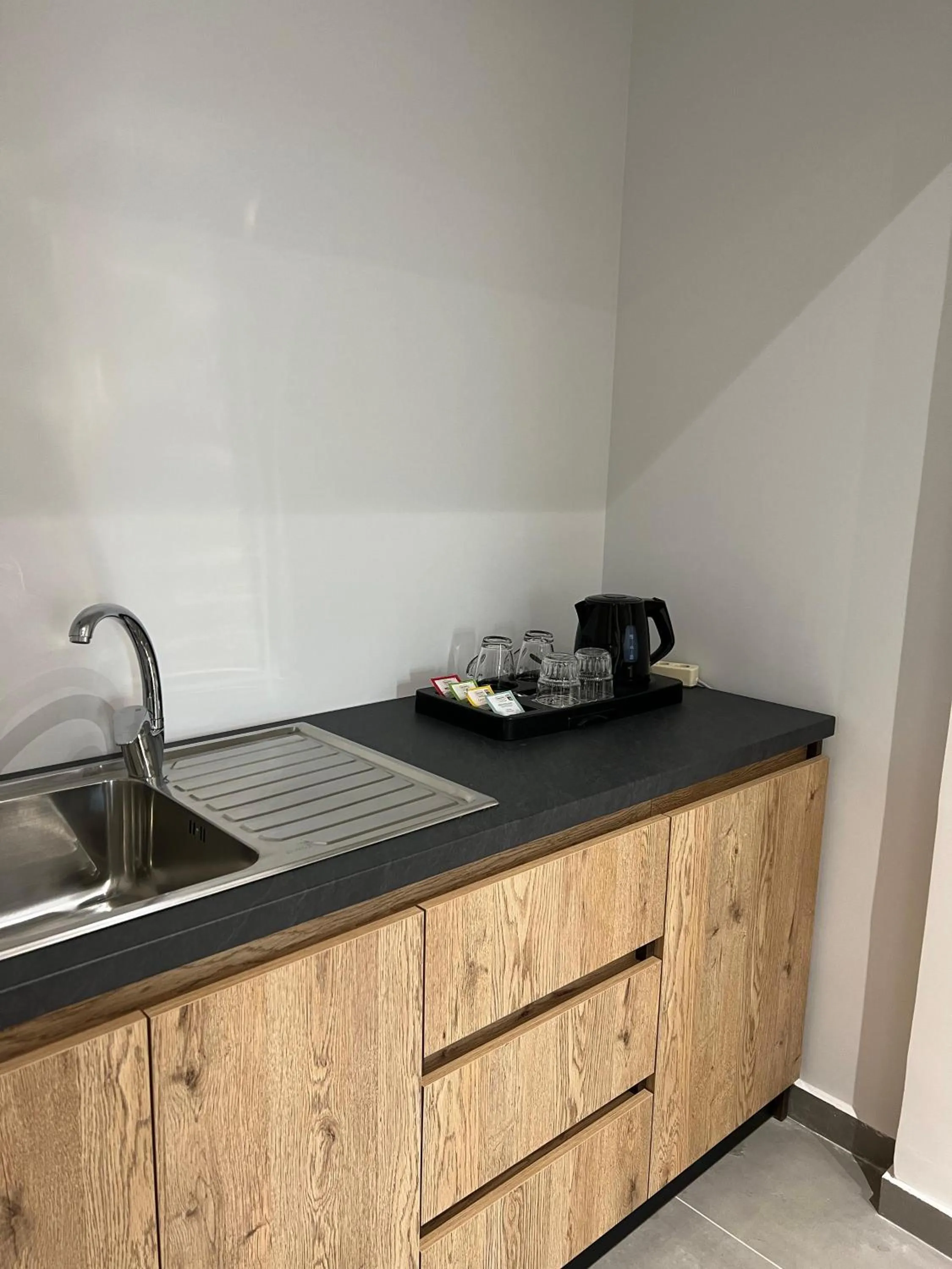 Kitchen or kitchenette in Garden Boutique Hotel