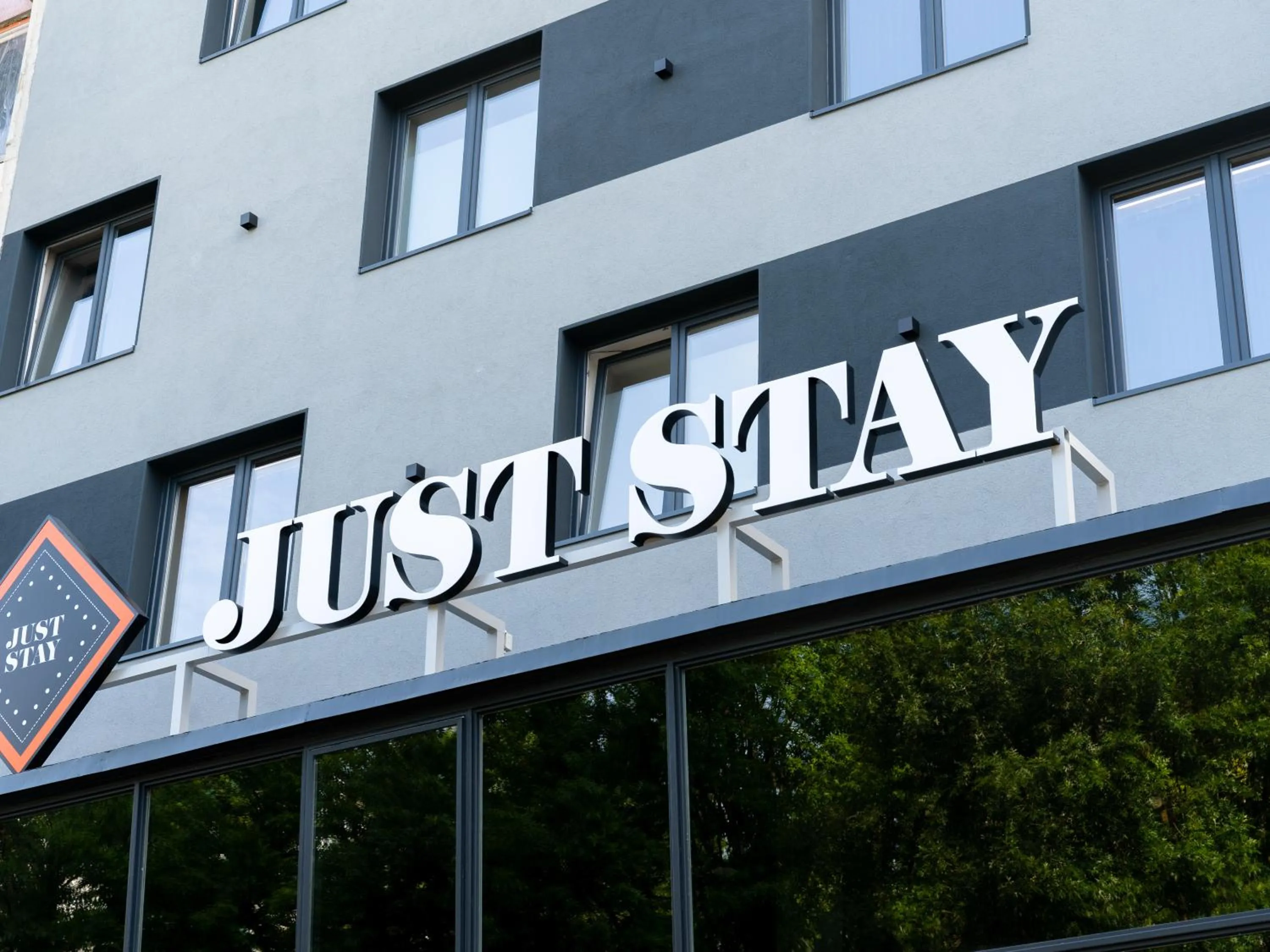 Property logo or sign in JustStay Essen Hotel & Apartments