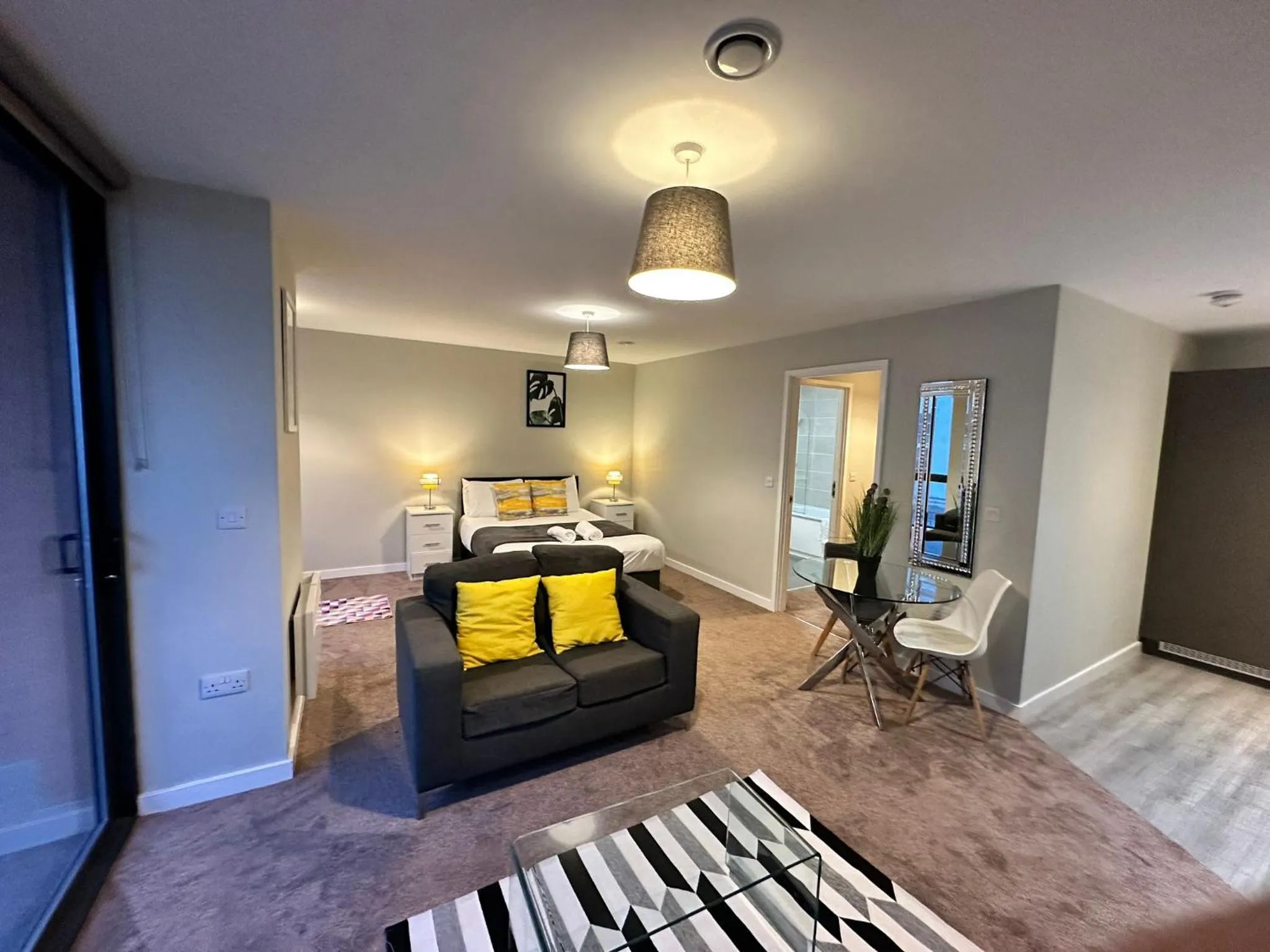 Living room, Bed in Adelphi Wharf Apartments by Beehosting