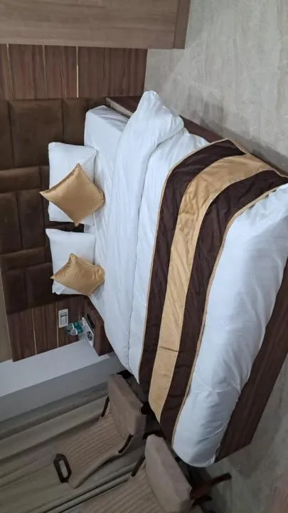 Bed in Hotel Navraj Palace