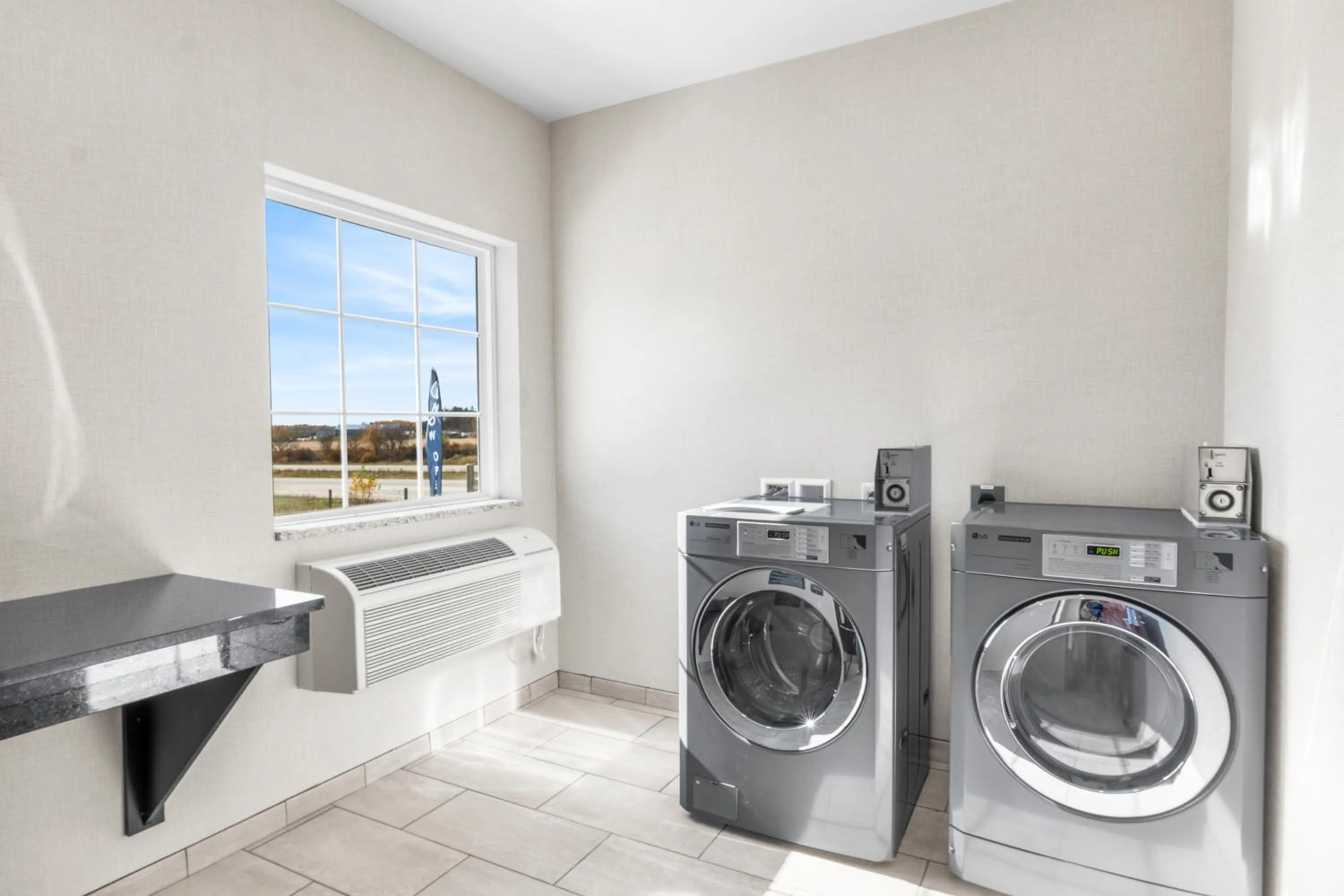laundry in Cobblestone Hotel & Suites Denmark - Green Bay