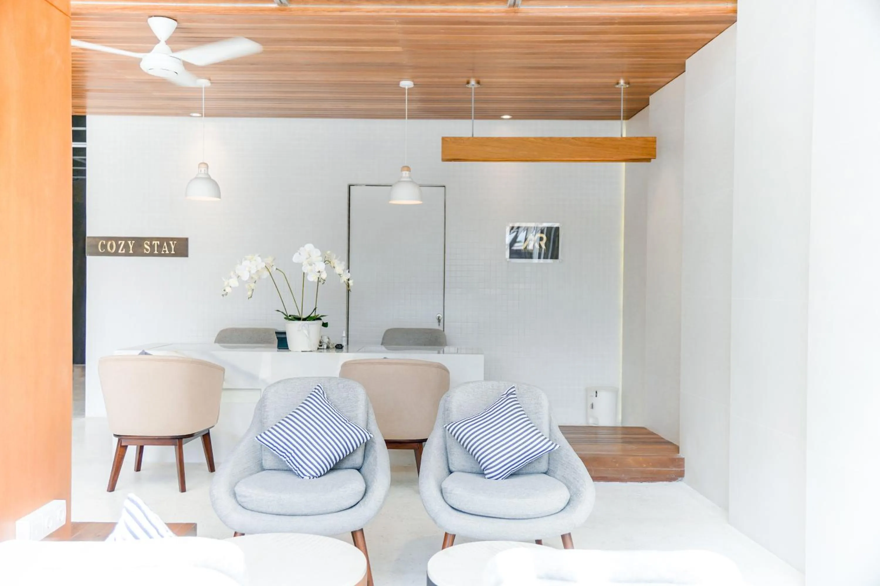 Seating area in Cozy Stay Bali by ARM Hospitality