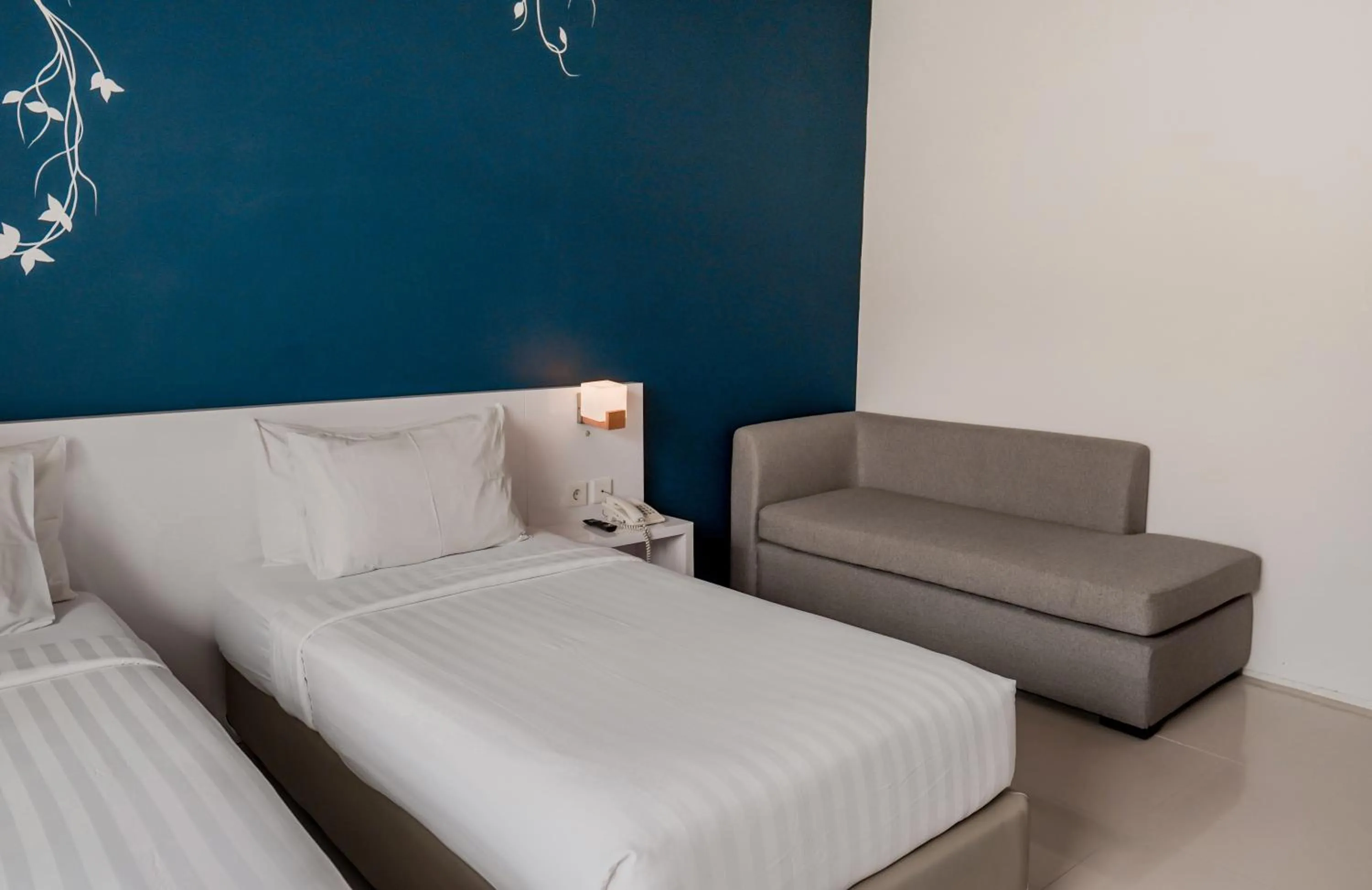 Bed in Cozy Stay Bali by ARM Hospitality