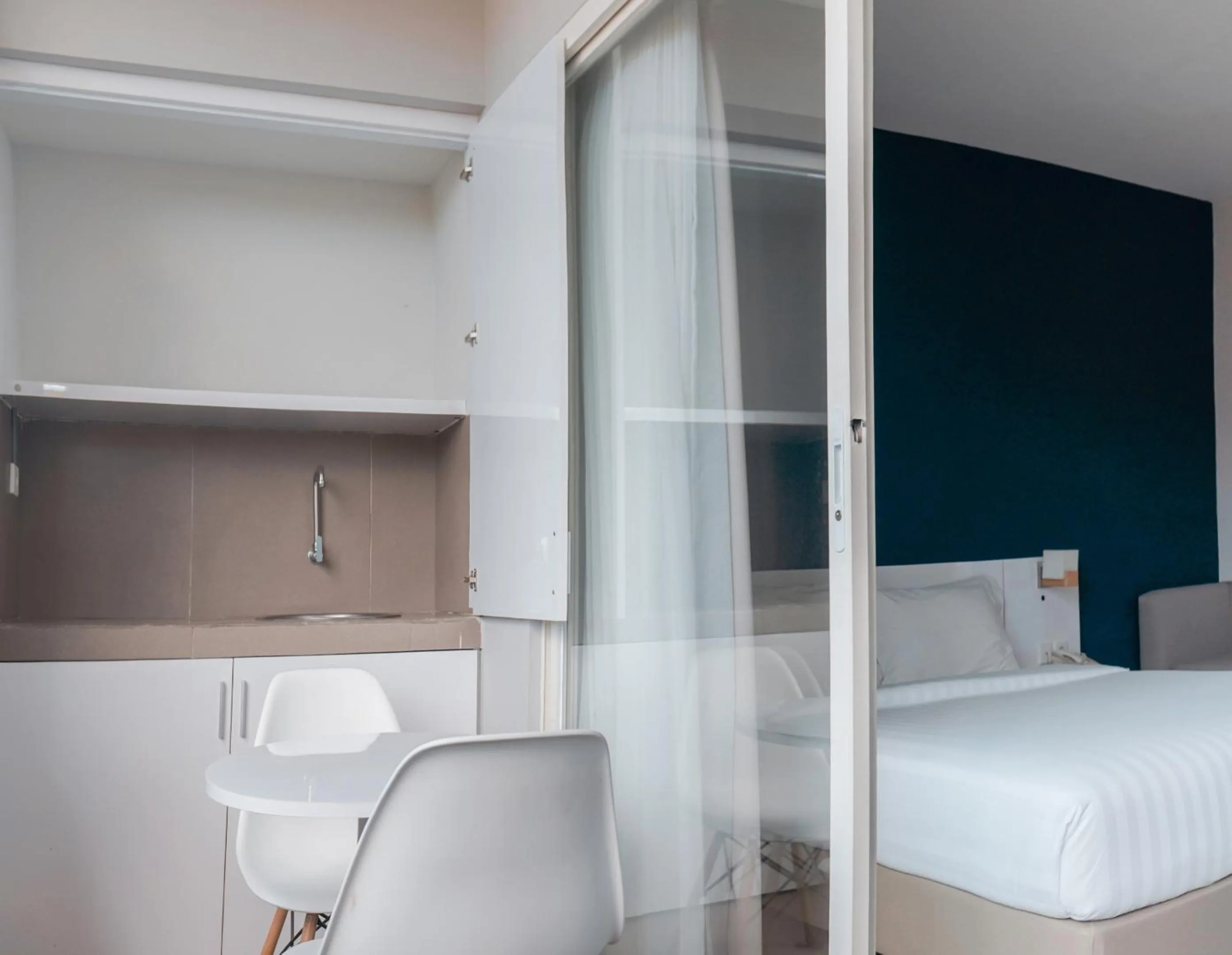 Bed in Cozy Stay Bali by ARM Hospitality