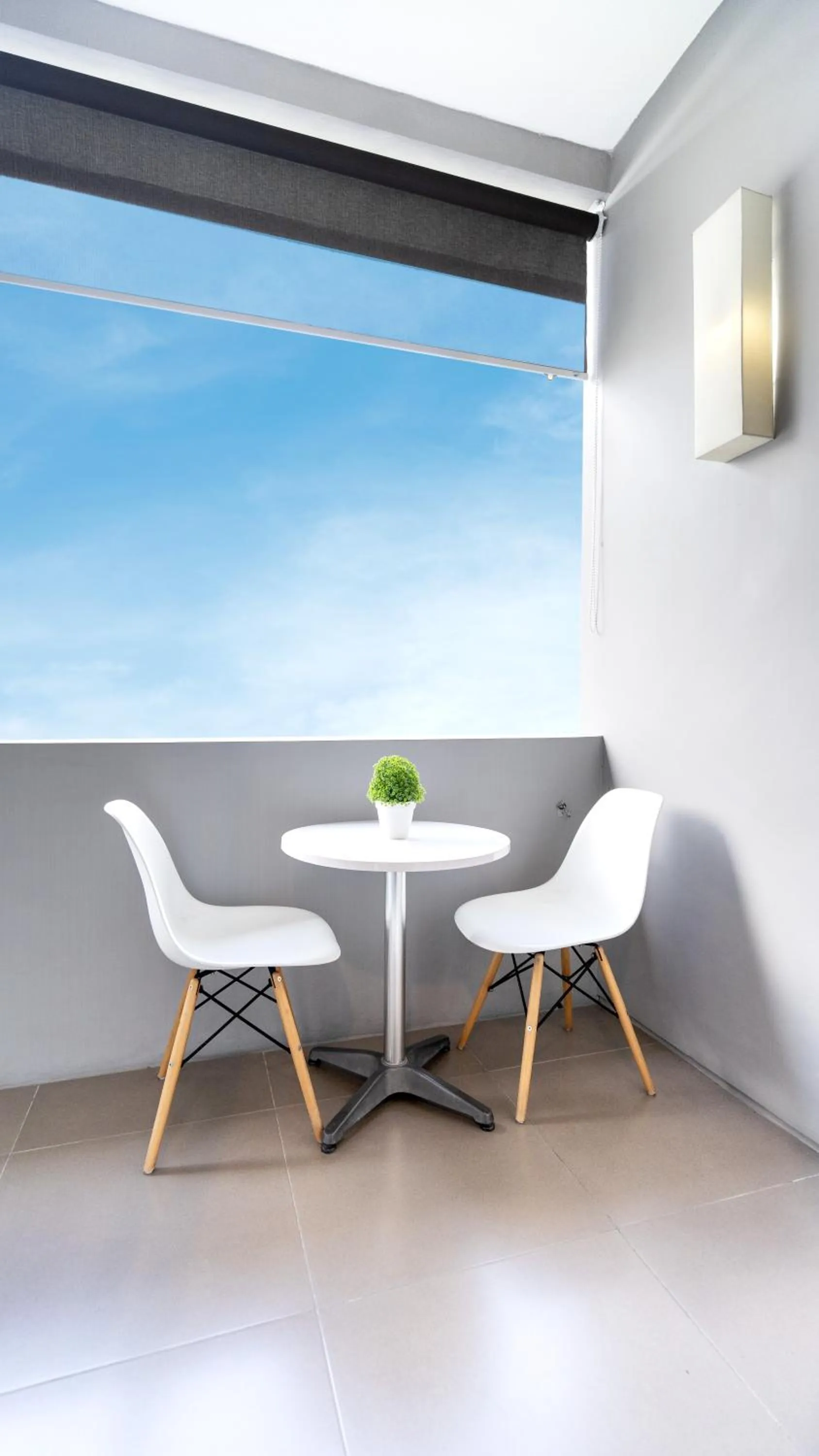 Seating area in Cozy Stay Bali by ARM Hospitality