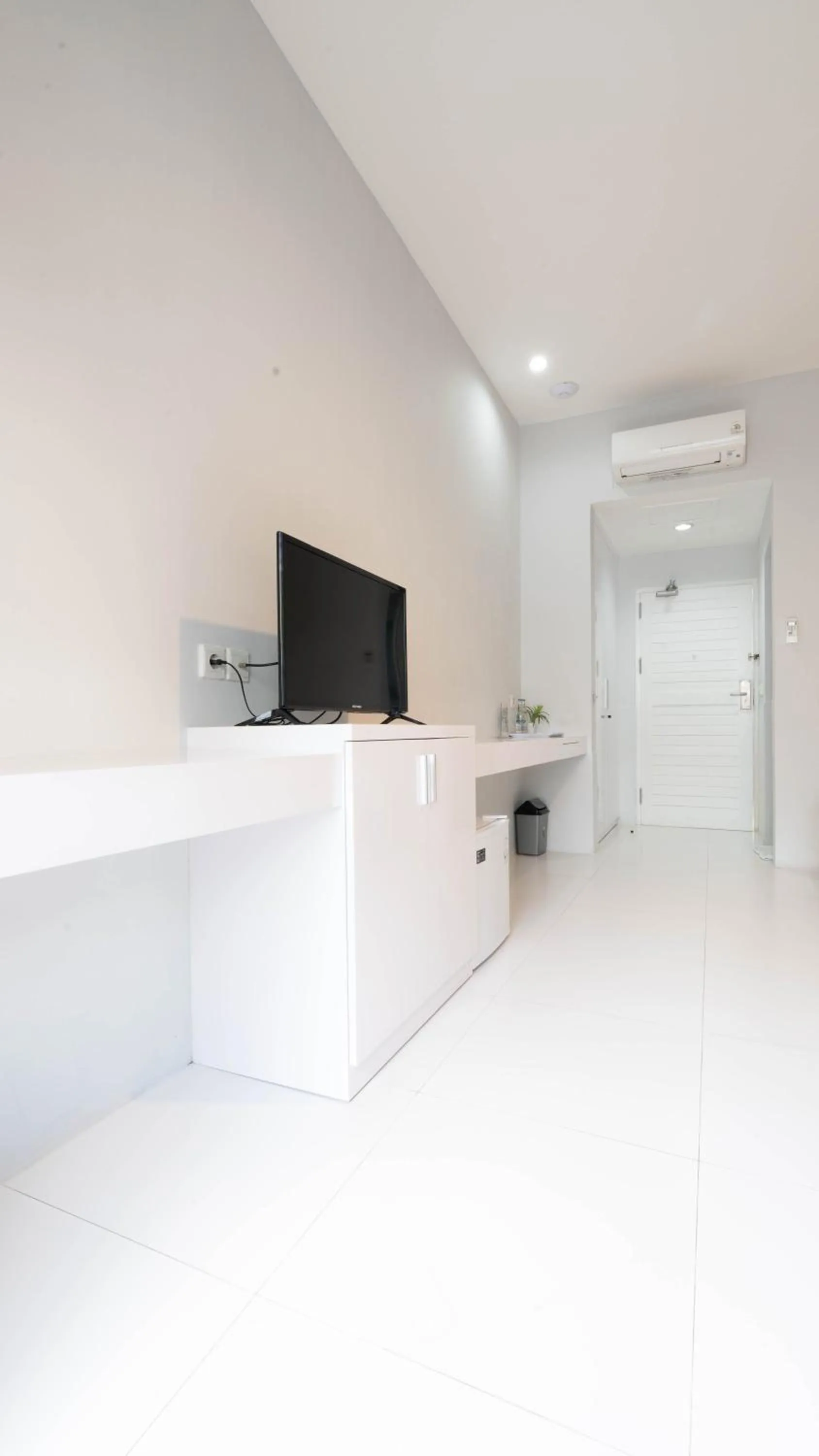 Communal lounge/ TV room in Cozy Stay Bali by ARM Hospitality