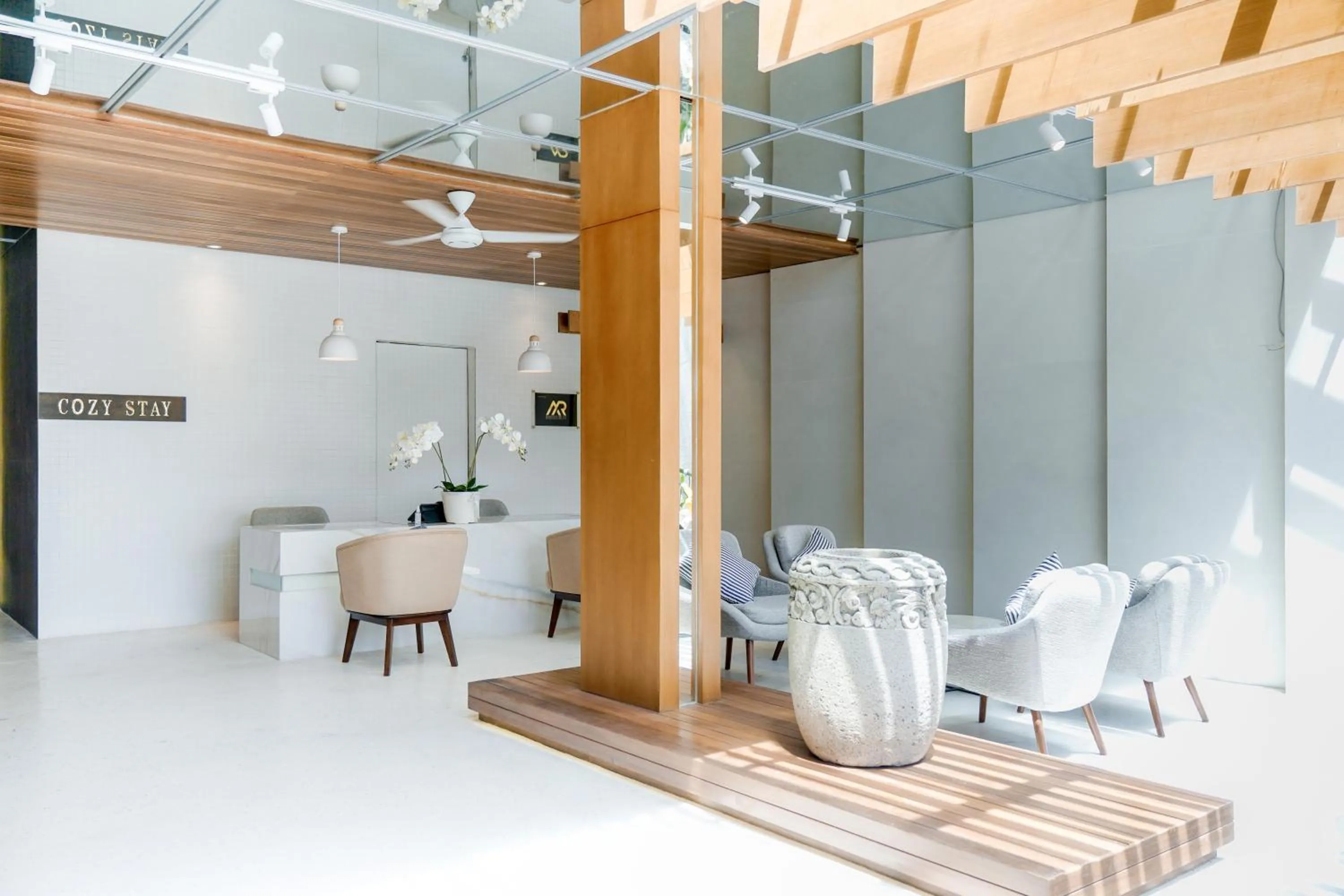 Seating area in Cozy Stay Bali by ARM Hospitality