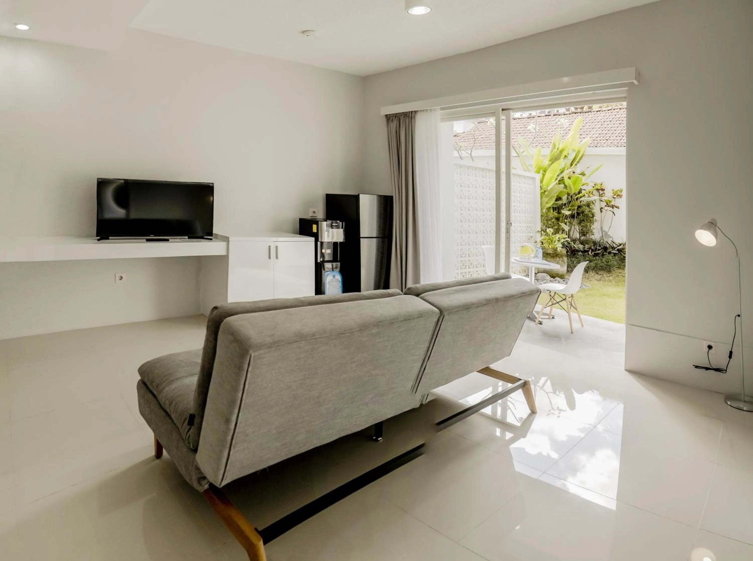 TV and multimedia in Cozy Stay Bali by ARM Hospitality