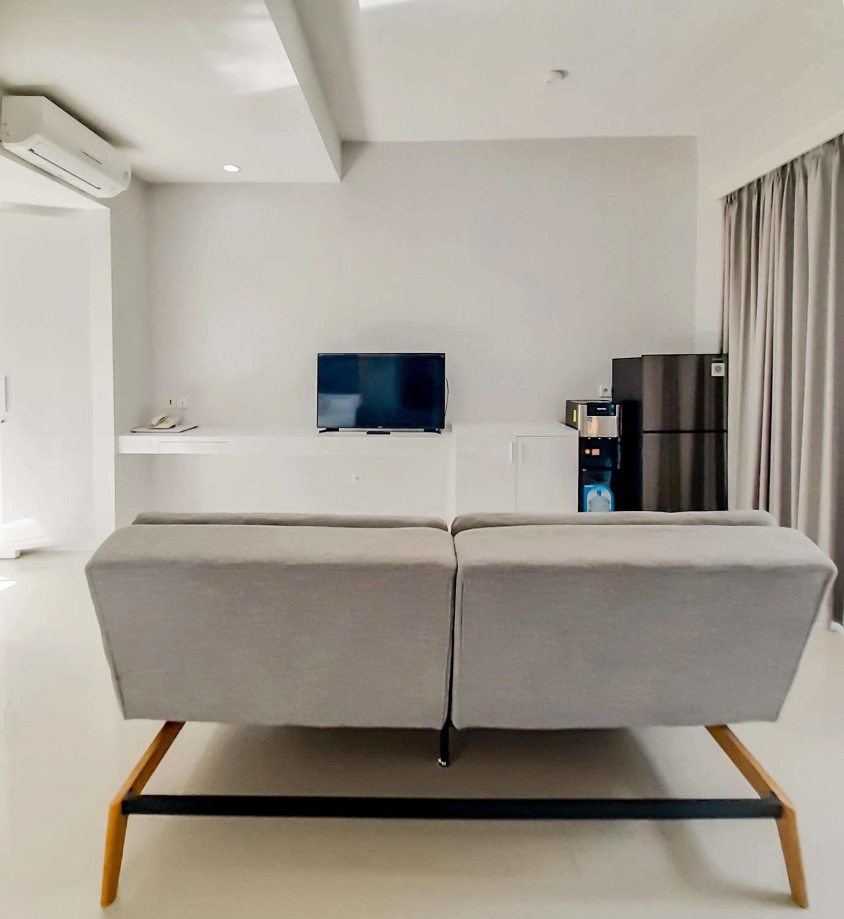 TV and multimedia in Cozy Stay Bali by ARM Hospitality