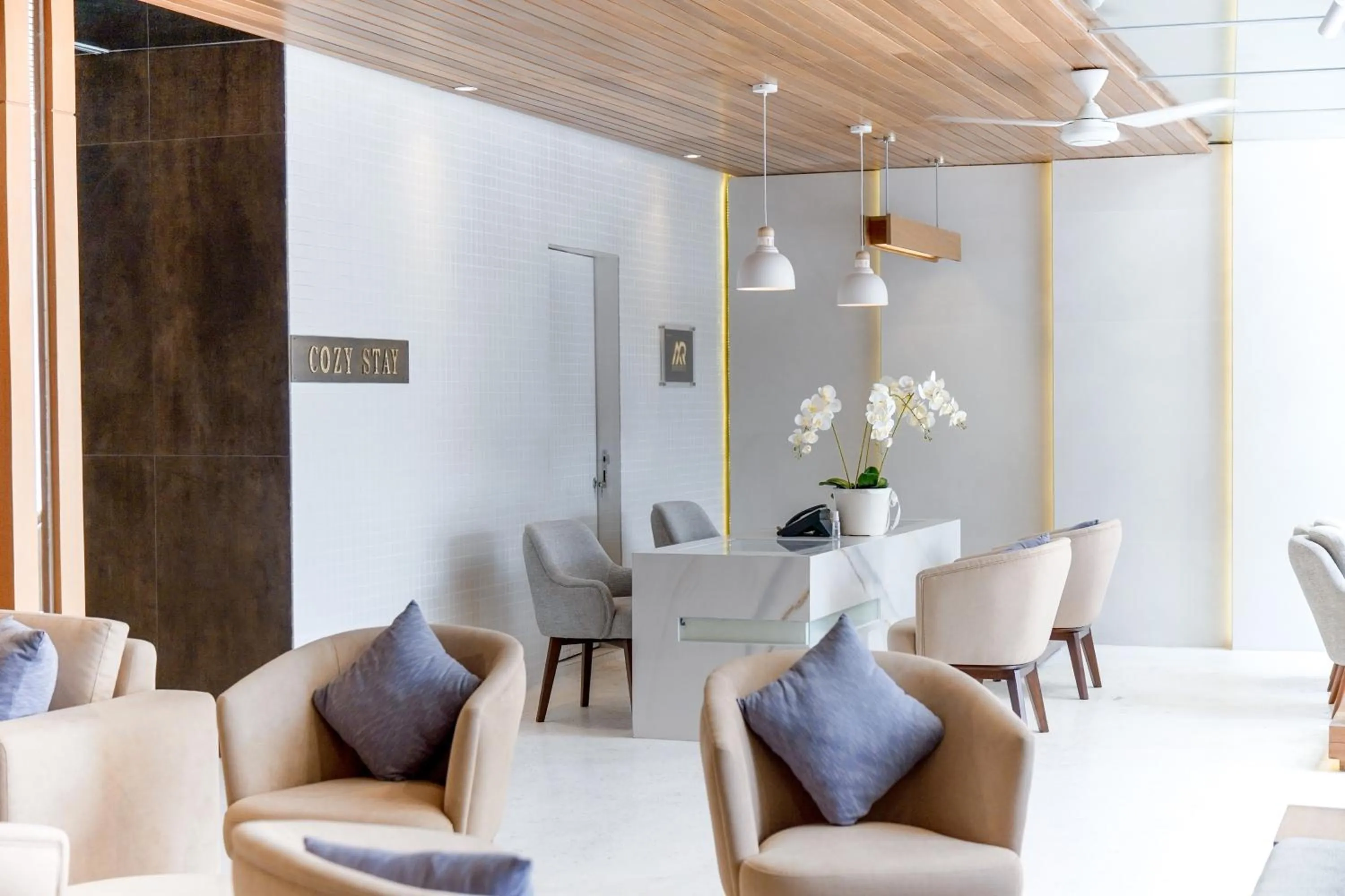 Seating area in Cozy Stay Bali by ARM Hospitality