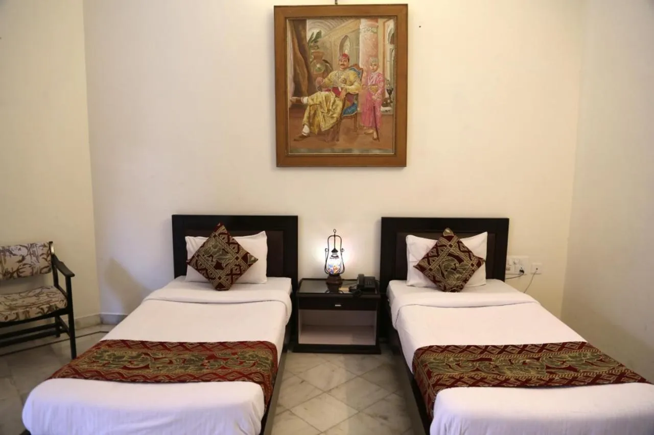 Bed in HOTEL KARAN VILLAS