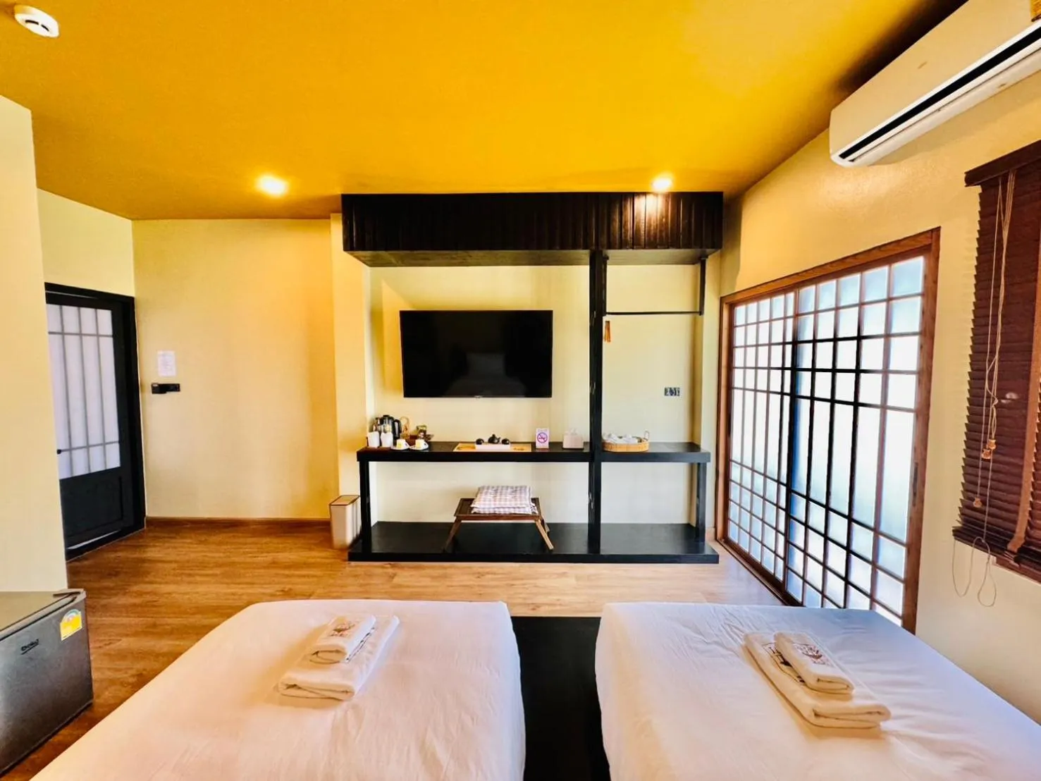 Bed in COZY SHIROI RESORT