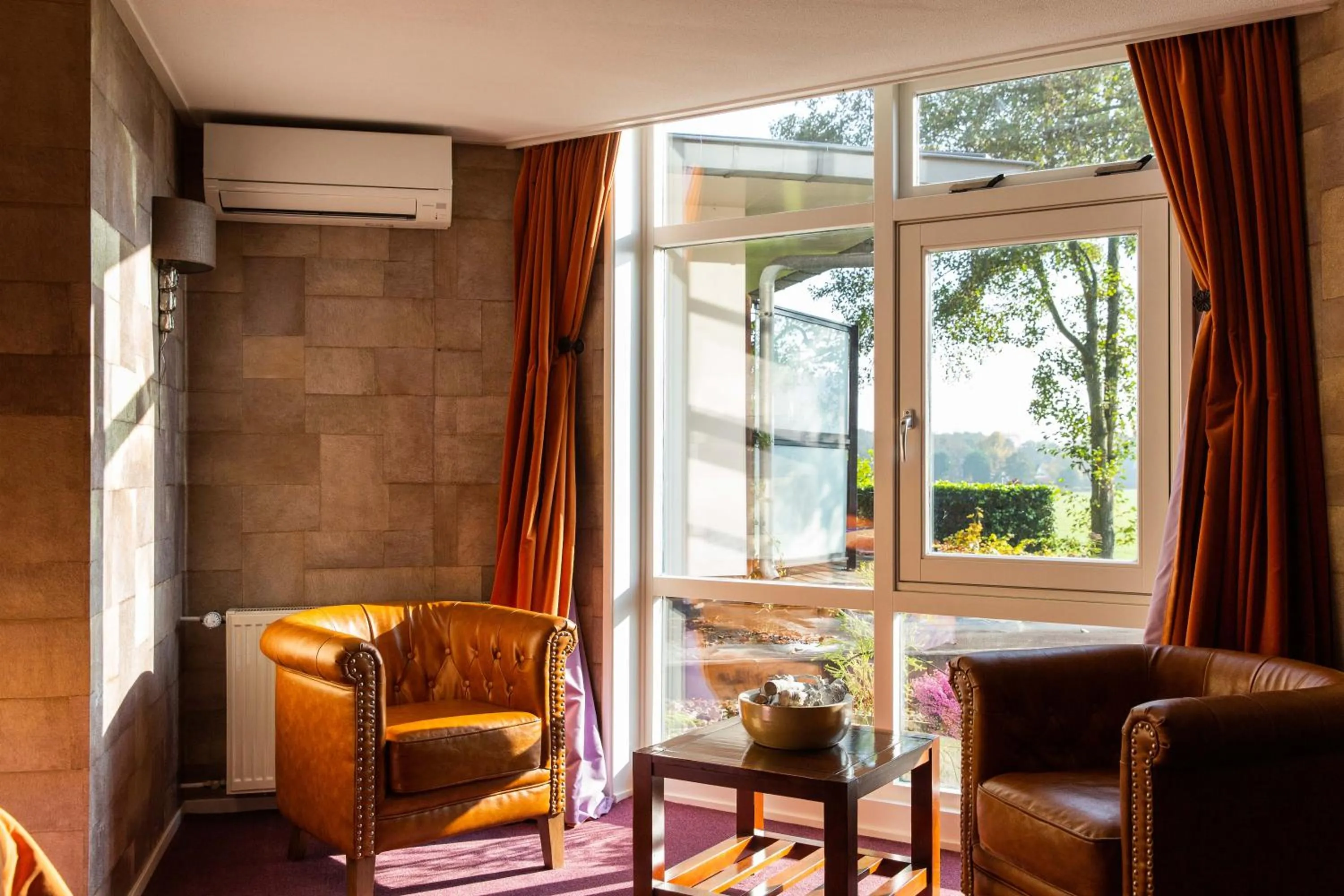 Seating area in Restaurant Hotel Merlet