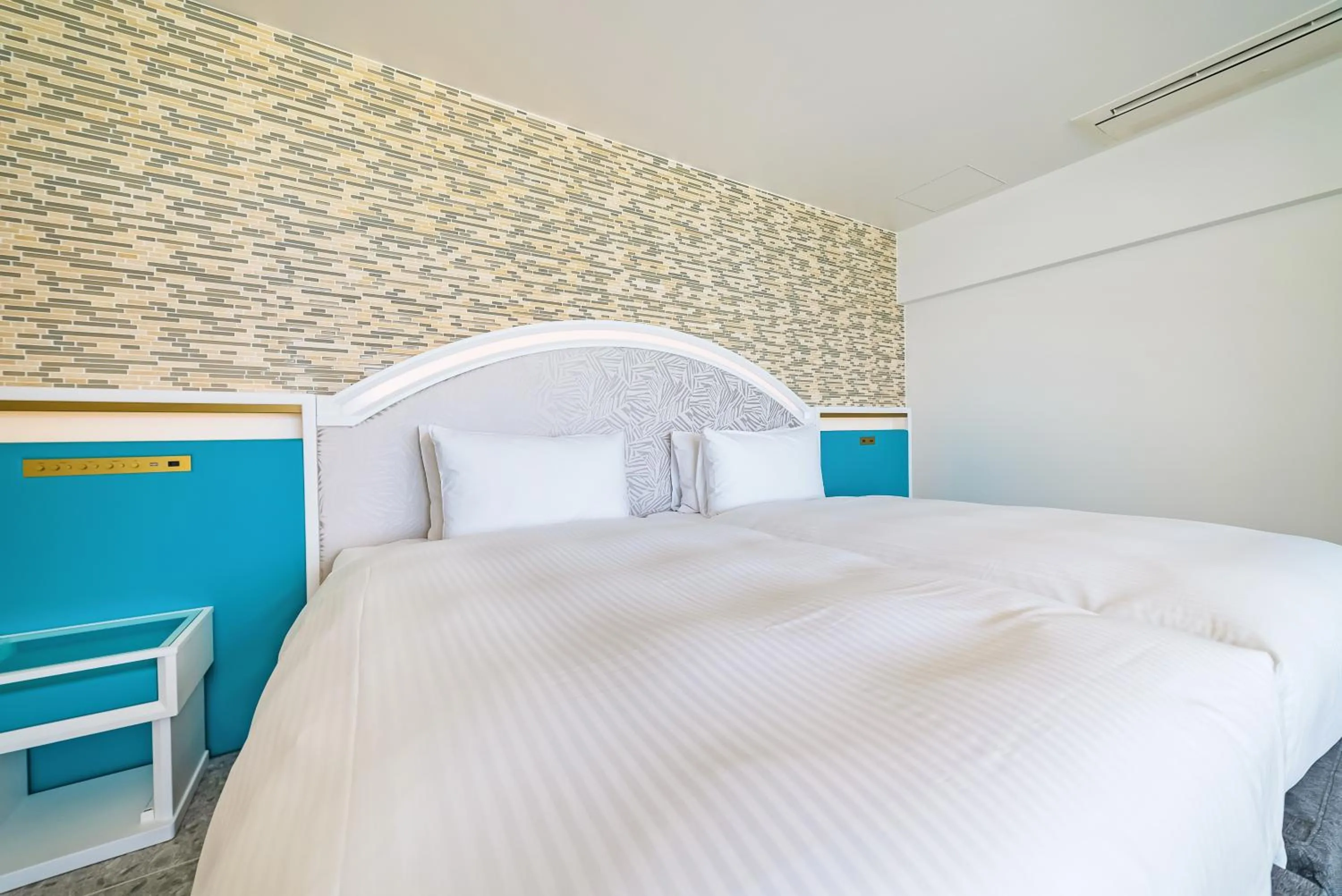 Bed in SANTORINI HOTEL&VILLAS MIYAKOJIMA