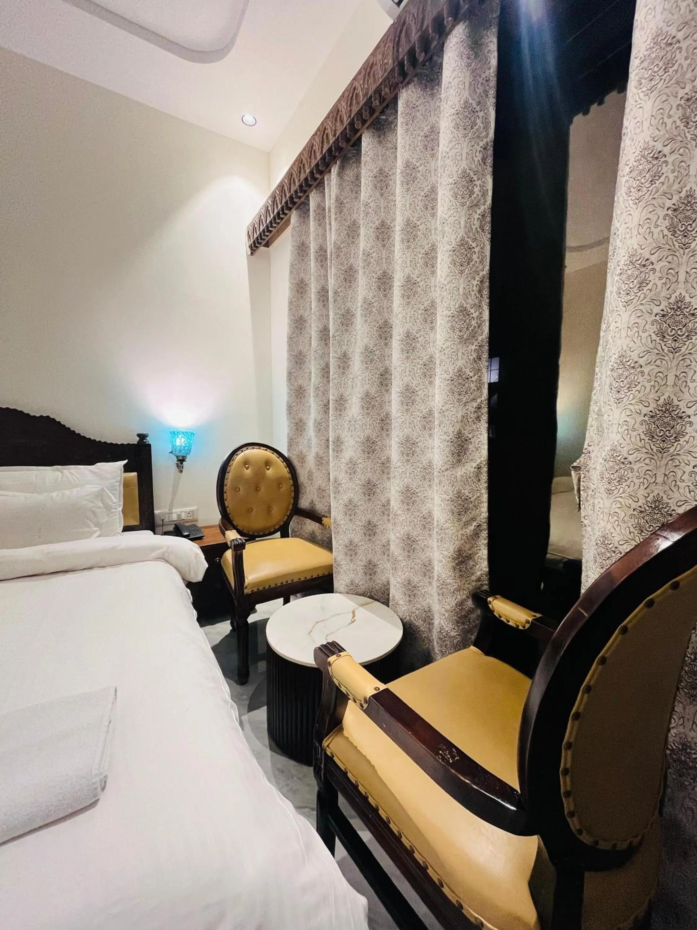 Seating area, Bed in Misty Blue Resort and Villas