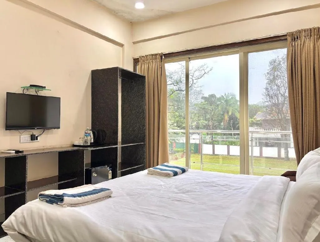 Bed in Misty Blue Resort and Villas