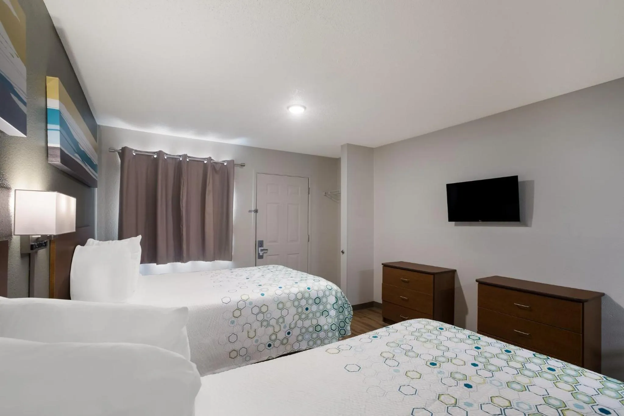 Photo of the whole room, Bed in HomeTowne Studios by Red Roof Covington, GA