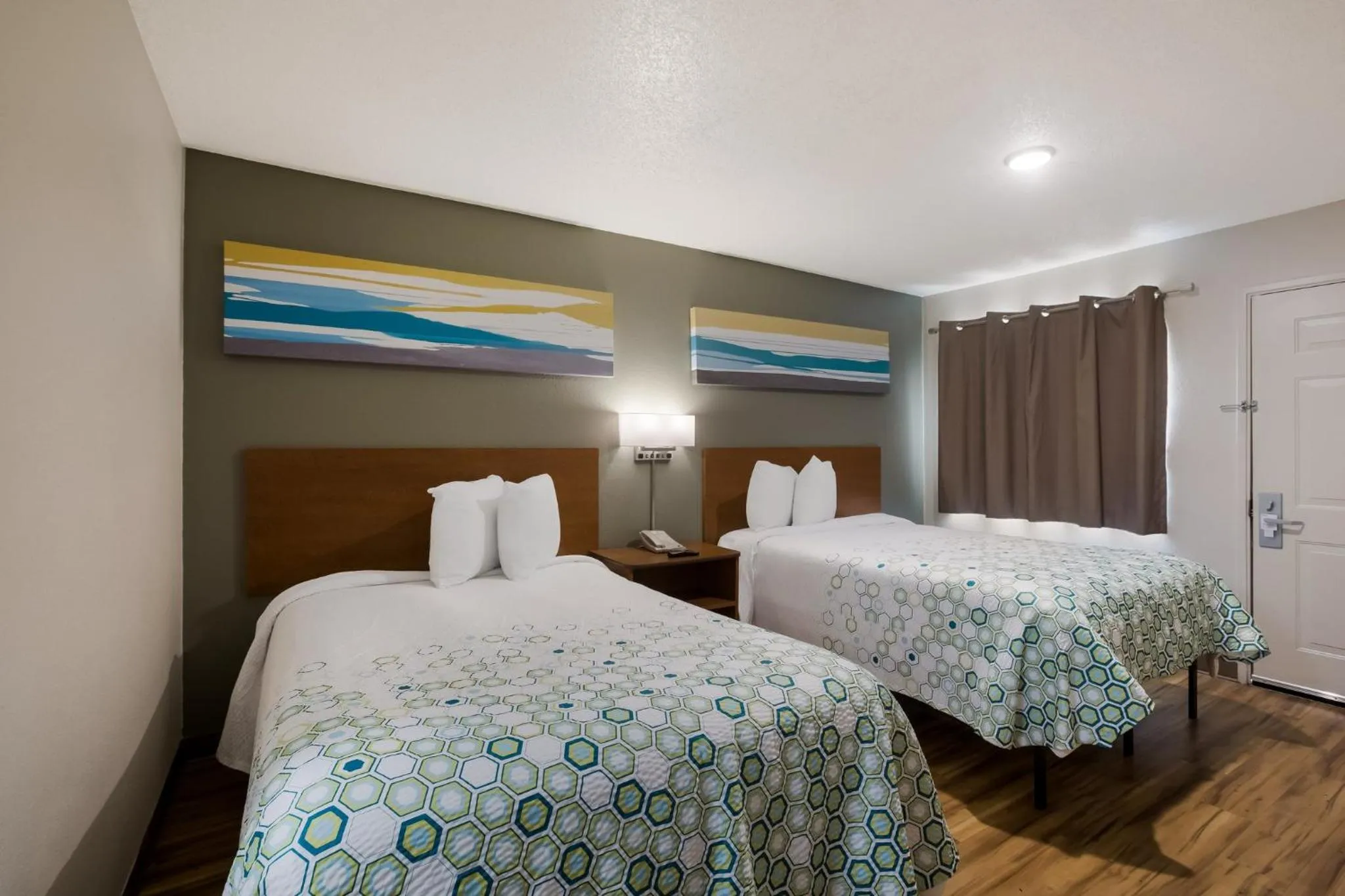 Photo of the whole room, Bed in HomeTowne Studios by Red Roof Covington, GA