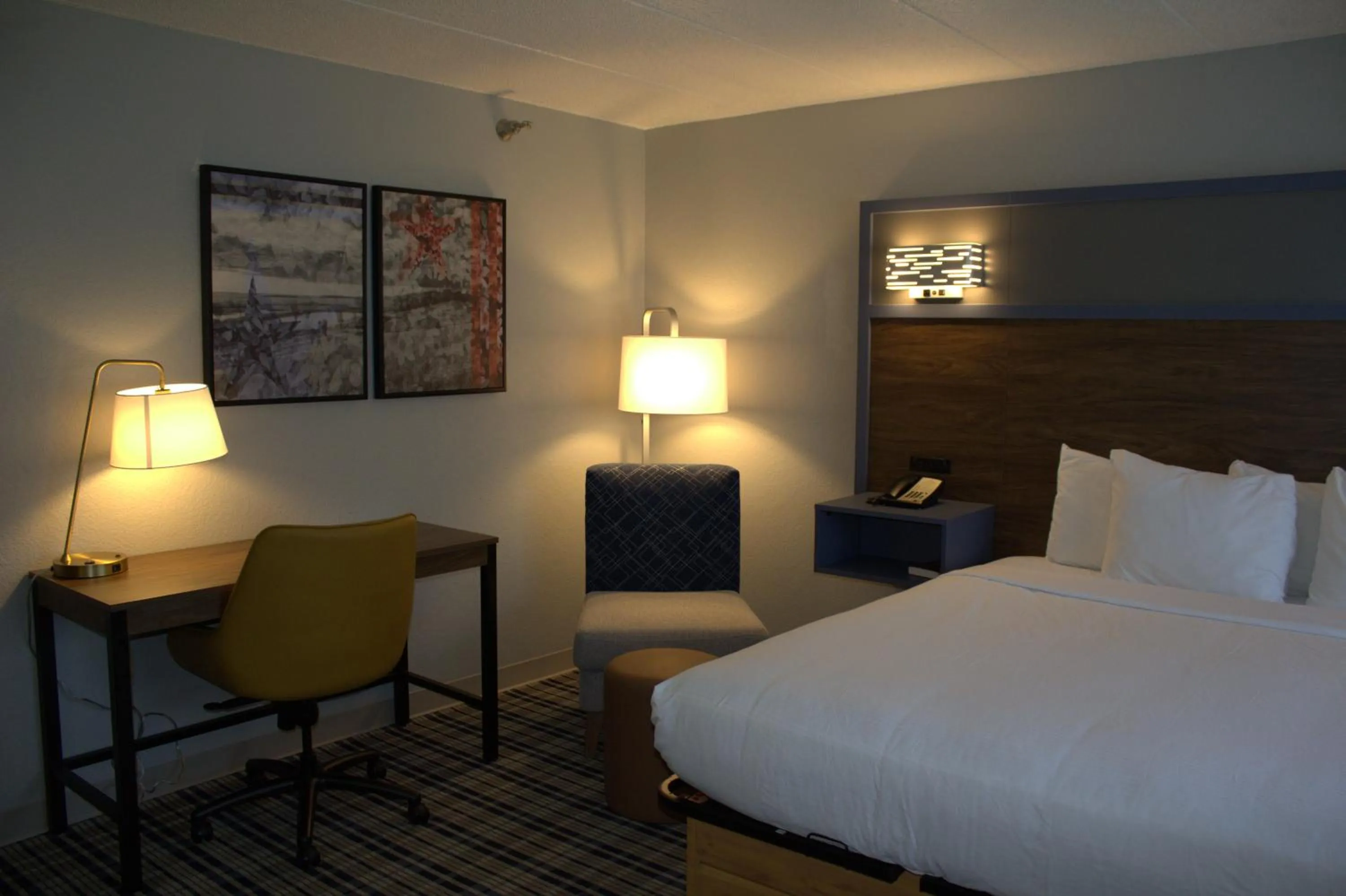 Bed in AmericInn by Wyndham Worthington