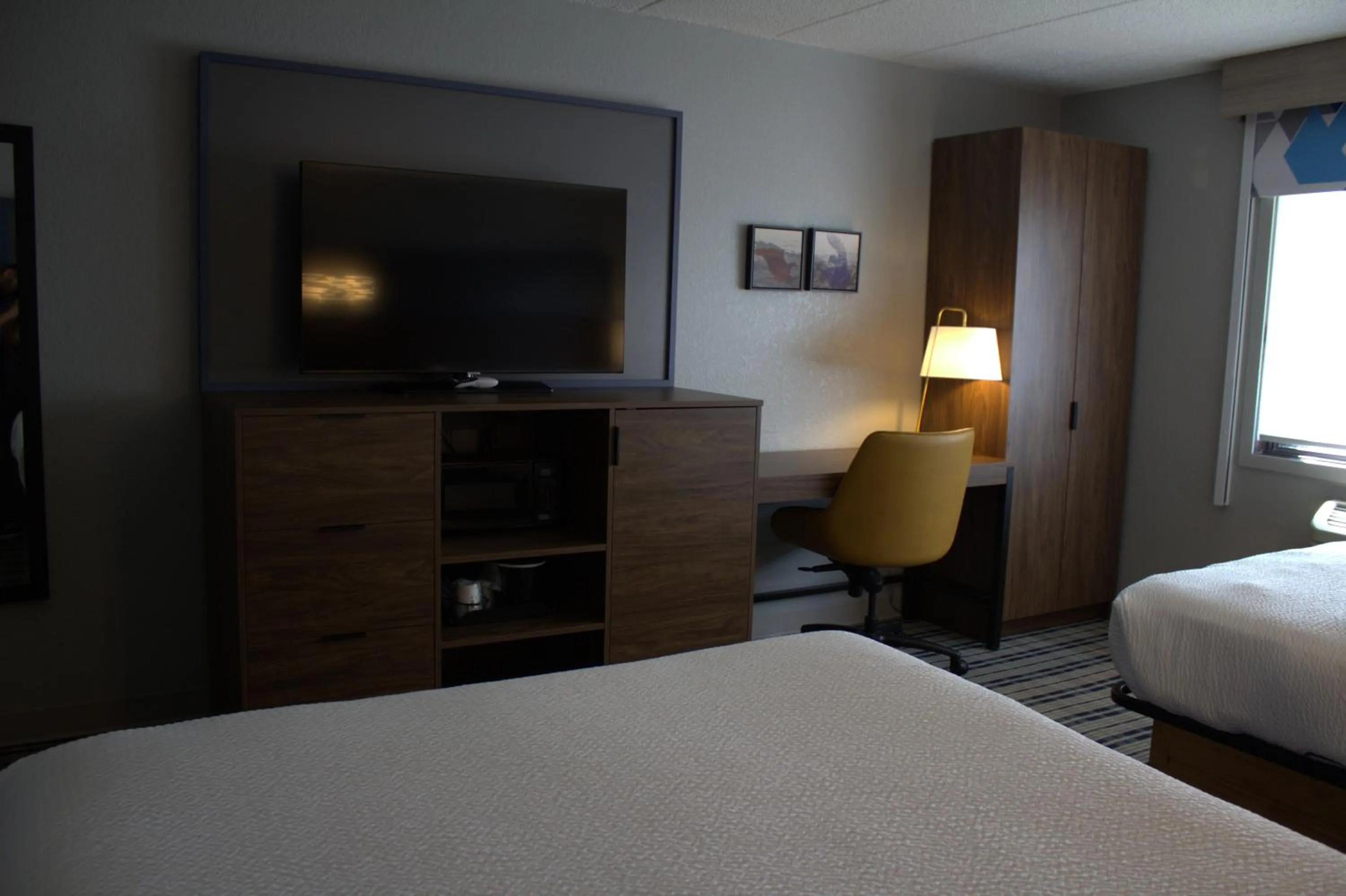 Bed in AmericInn by Wyndham Worthington