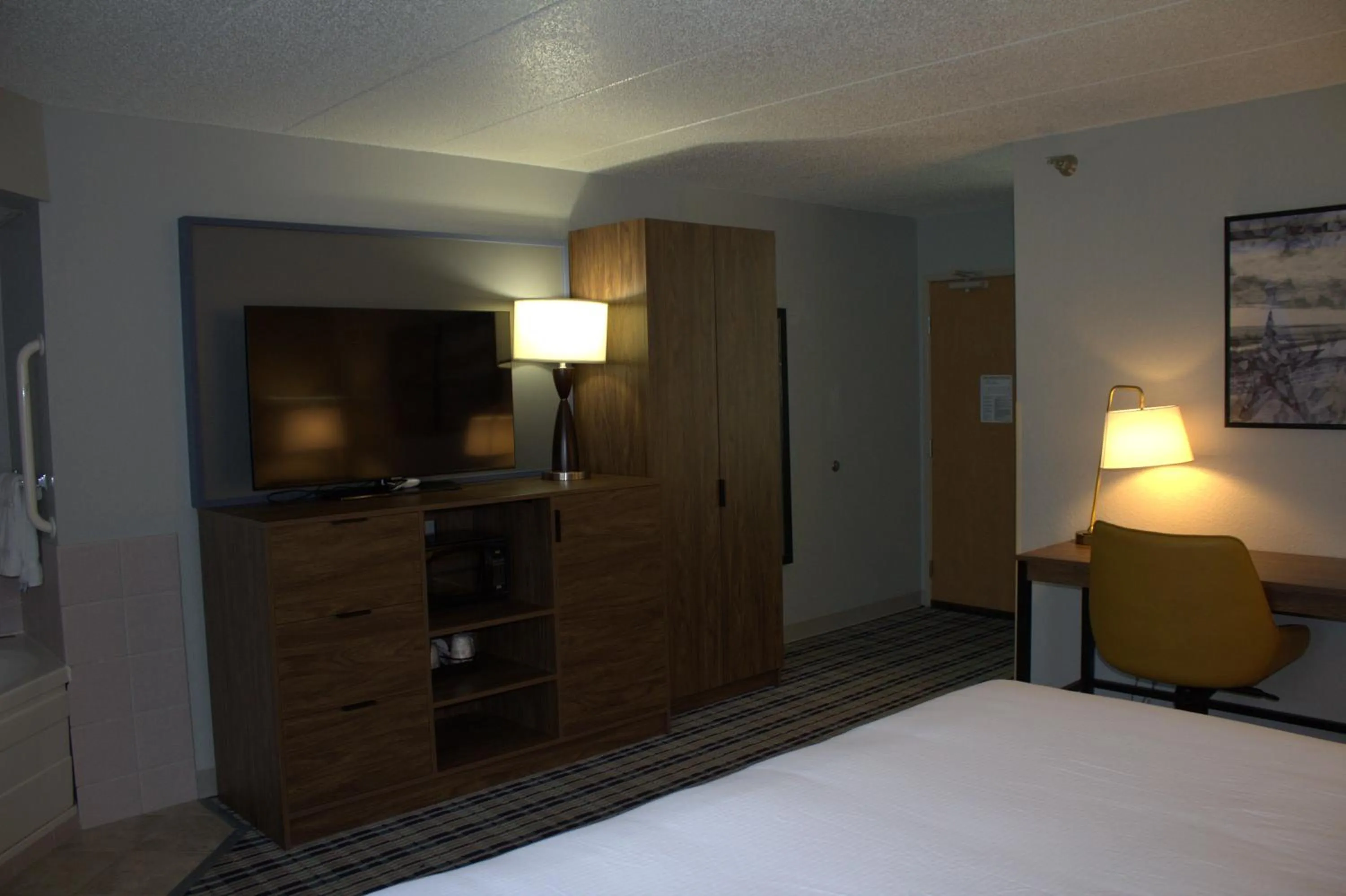 Bed in AmericInn by Wyndham Worthington