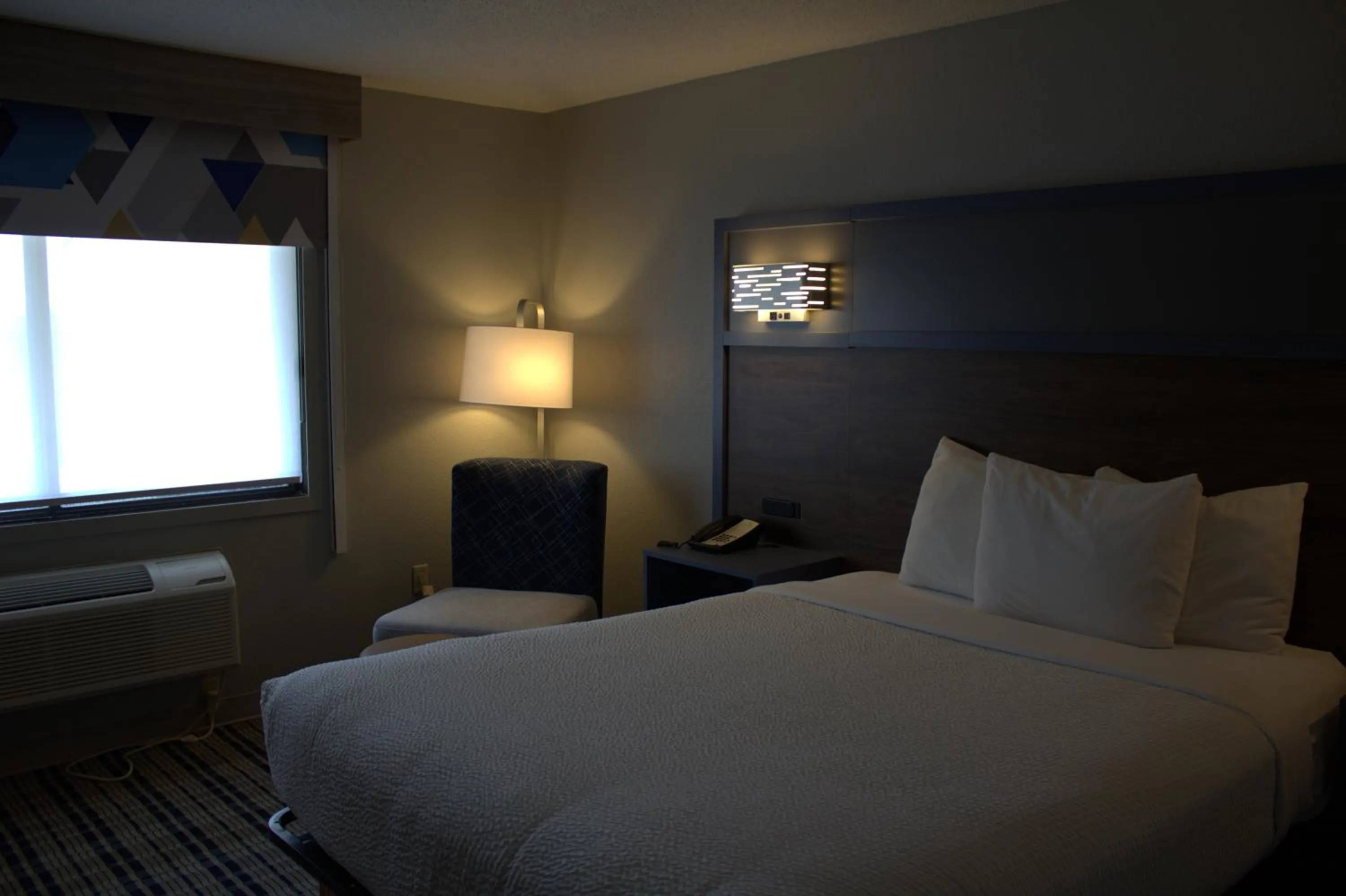 Bed in AmericInn by Wyndham Worthington