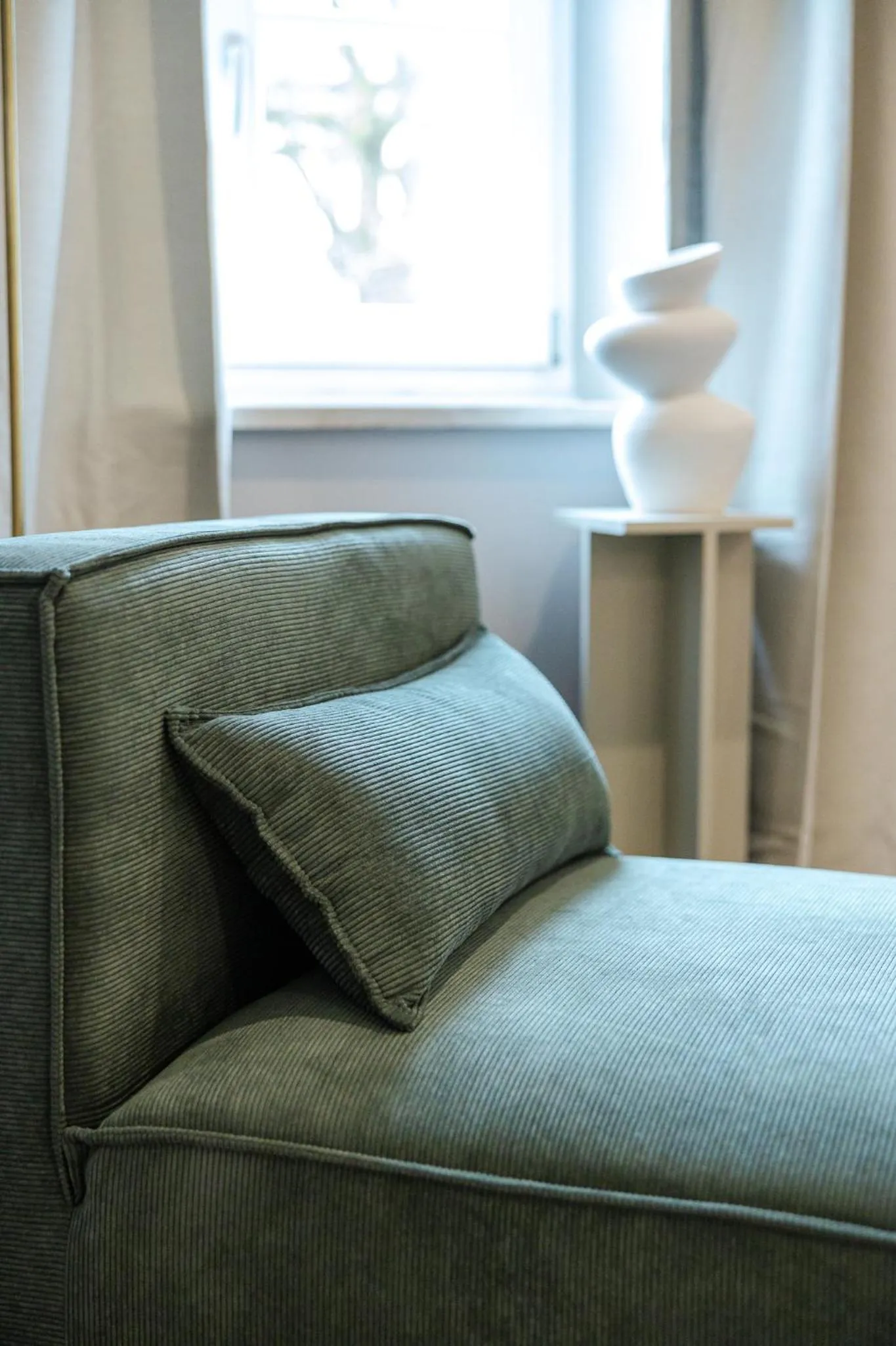 Seating area in kalm stay - a design Aparthotel