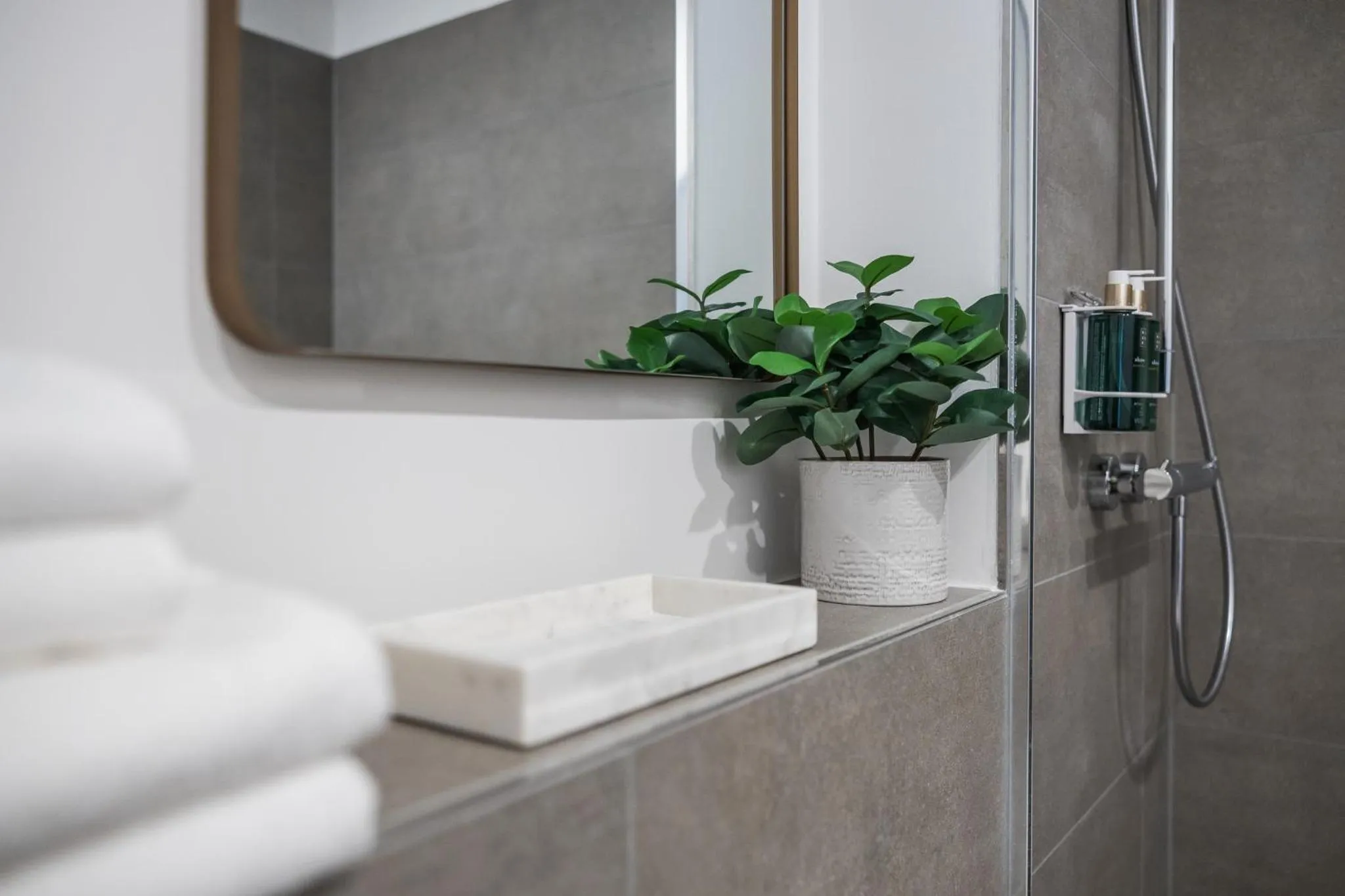 Bathroom in kalm stay - a design Aparthotel