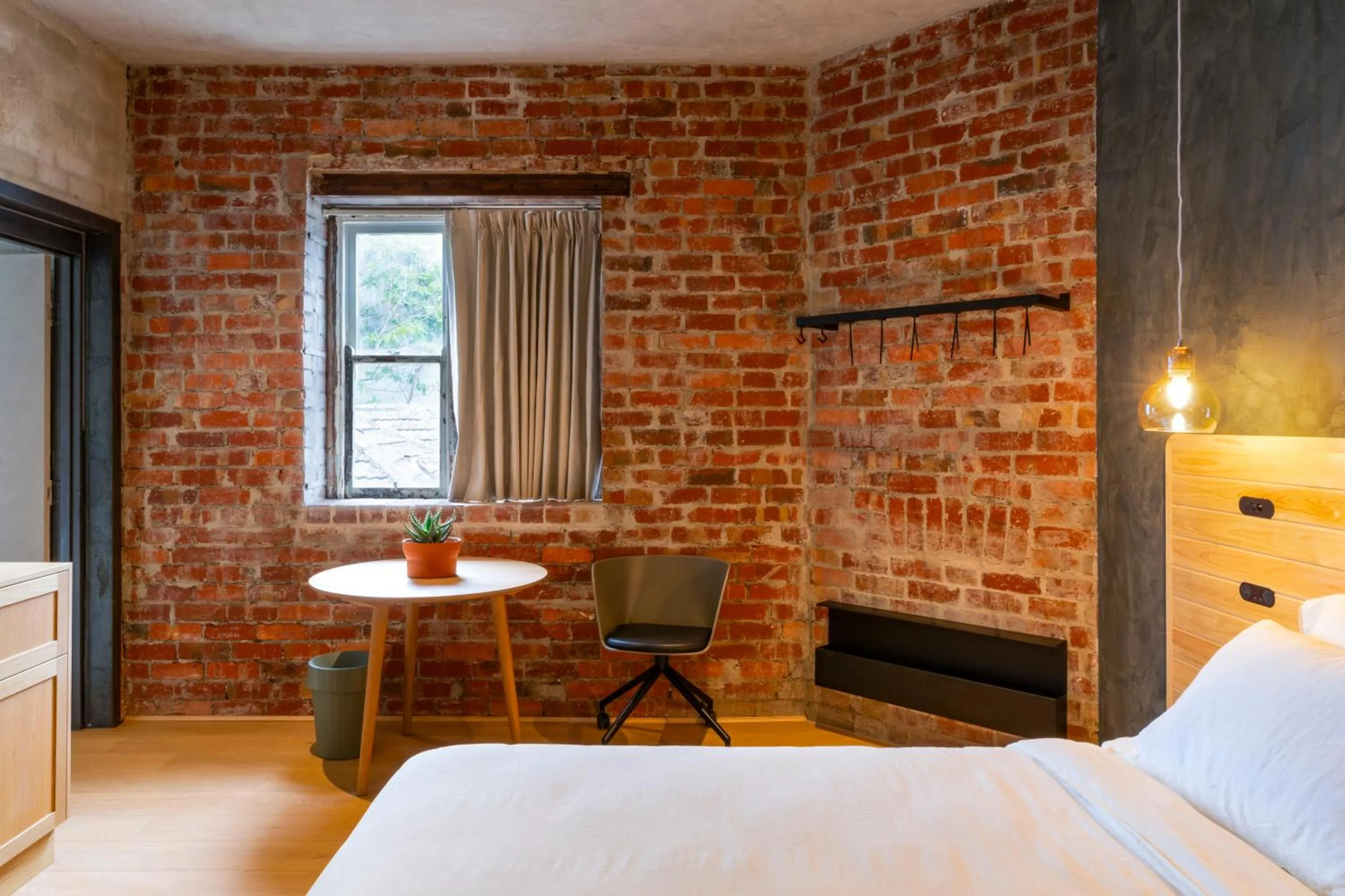 Seating area, Bed in In The Brick Spa And Hotel