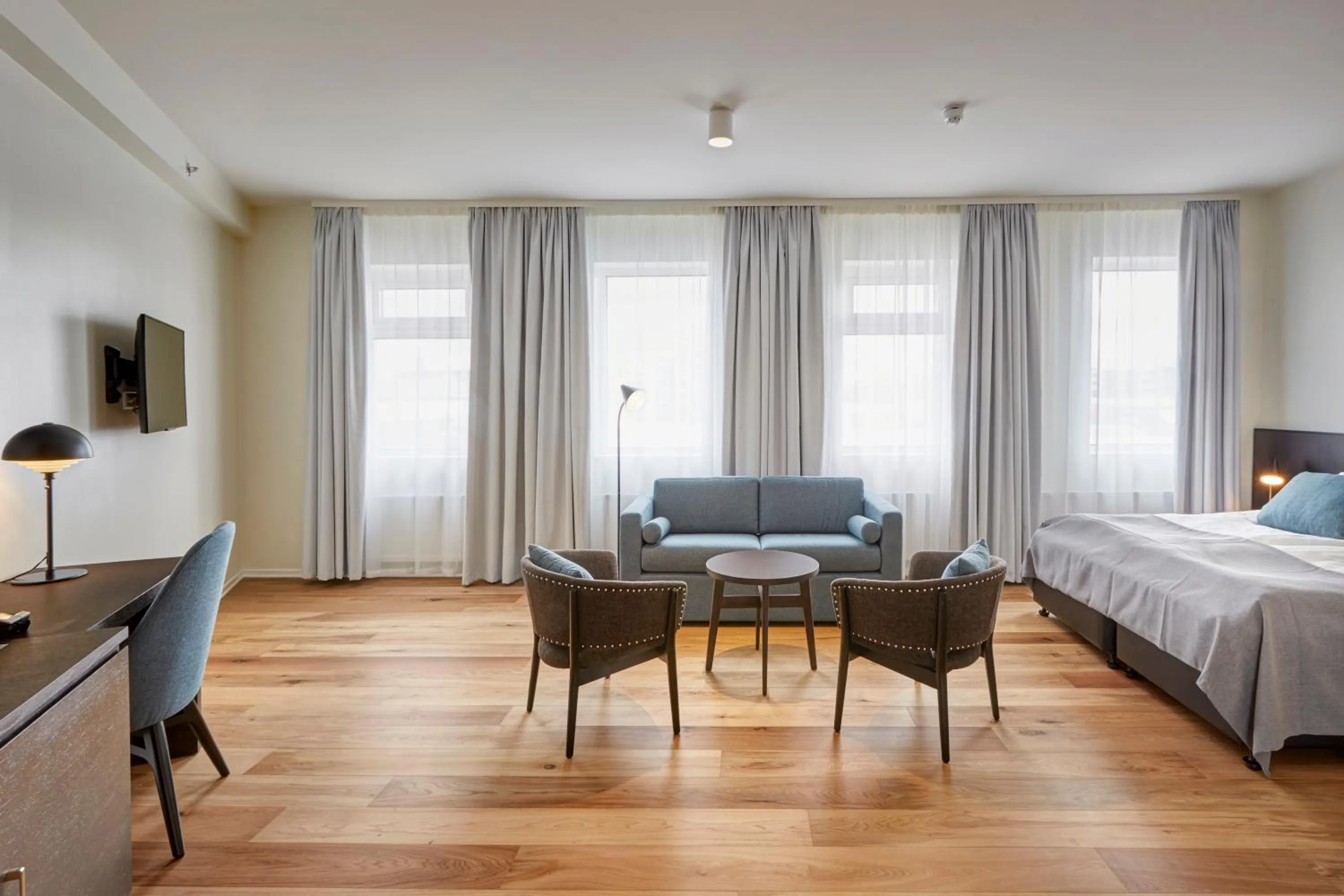 Seating area, Bed in Fosshotel Reykjavík