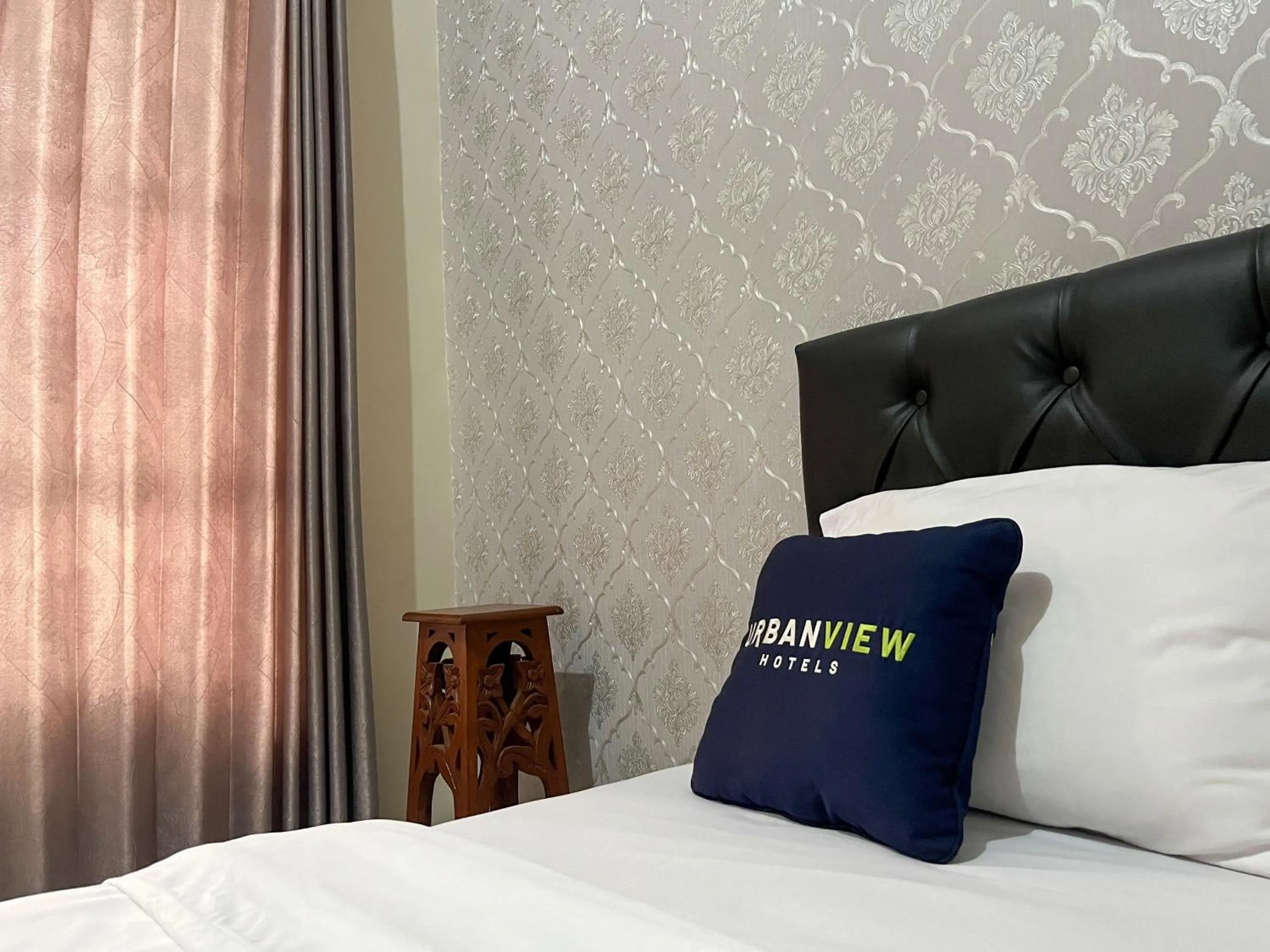 Bed in Urbanview Syariah Hotel Kanigara Batu