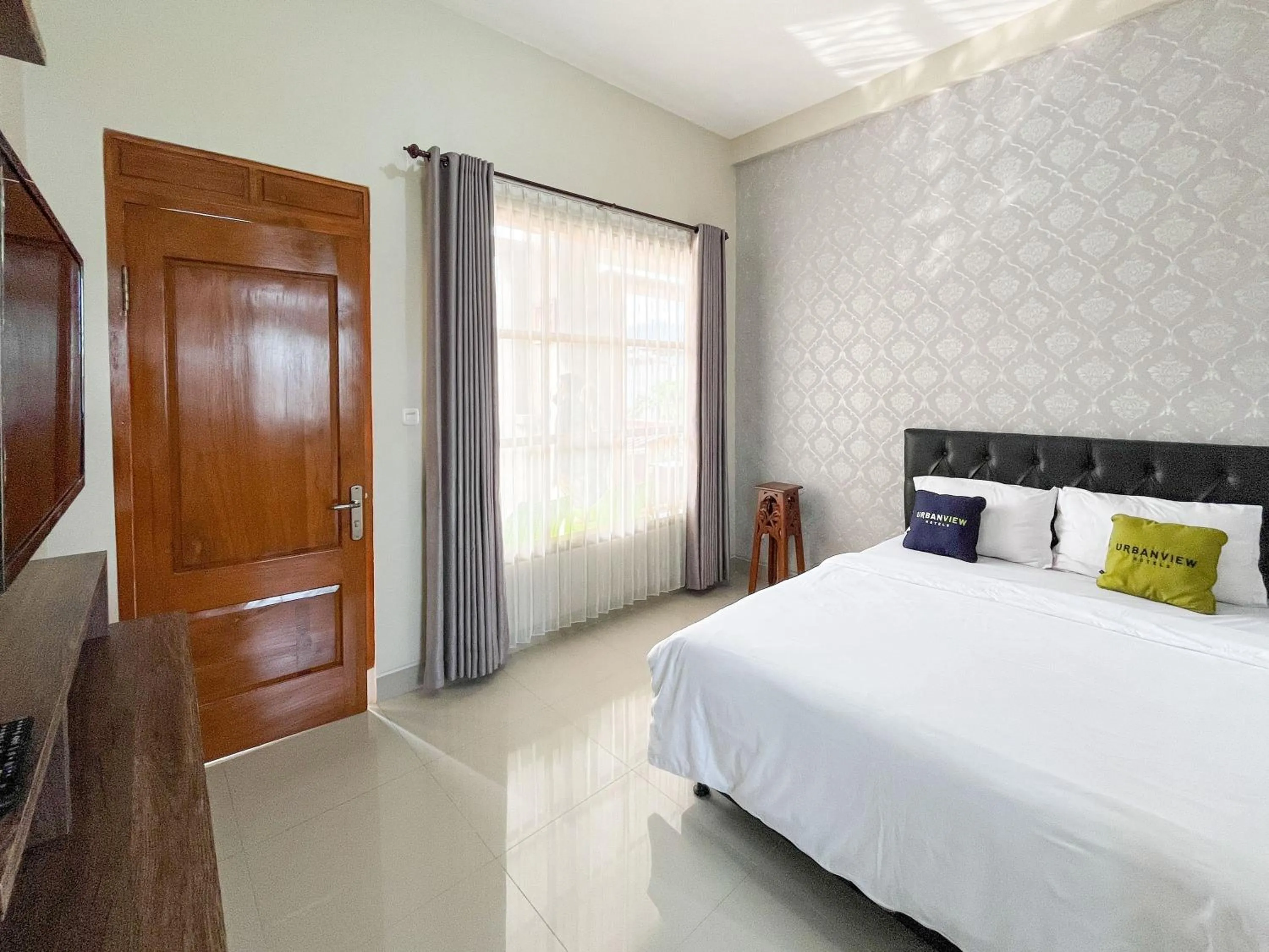 Bed in Urbanview Syariah Hotel Kanigara Batu