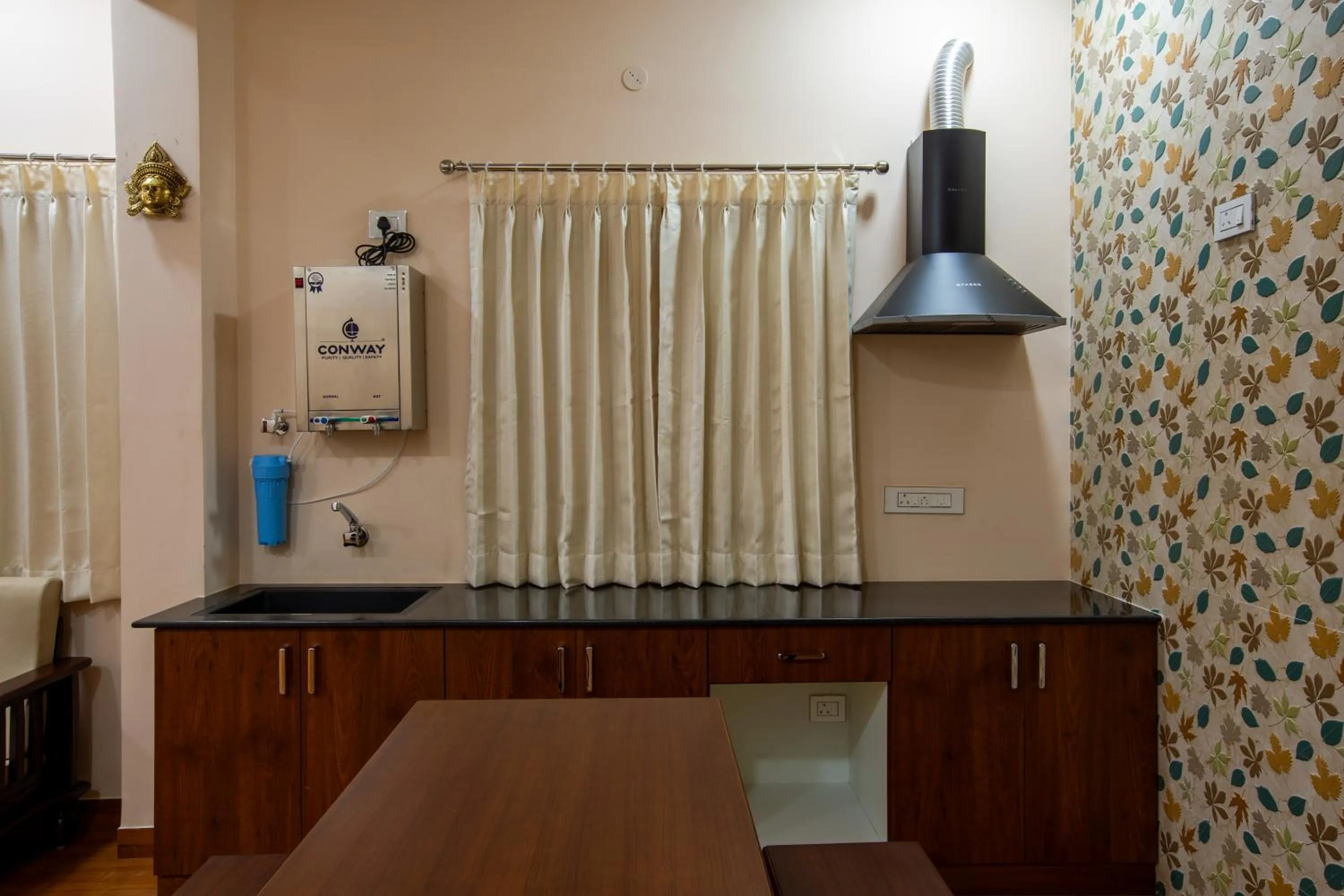 Kitchen or kitchenette in MUGUNDAN 'S SMART STAY