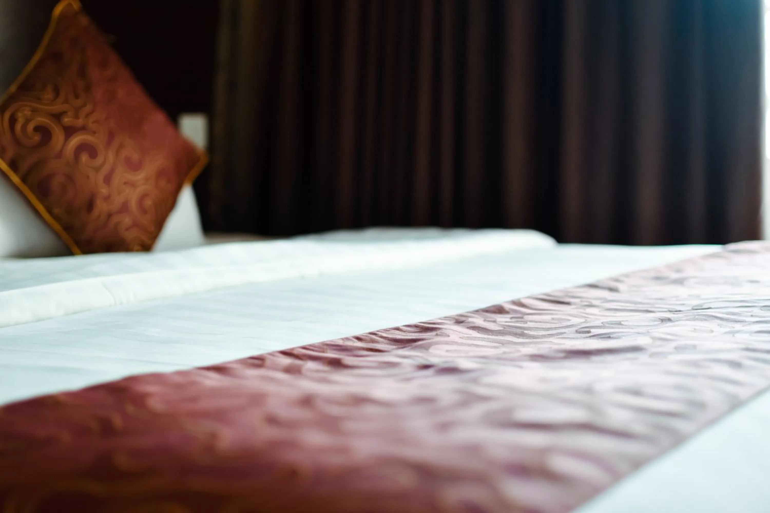 Bed in J Suites Hotel