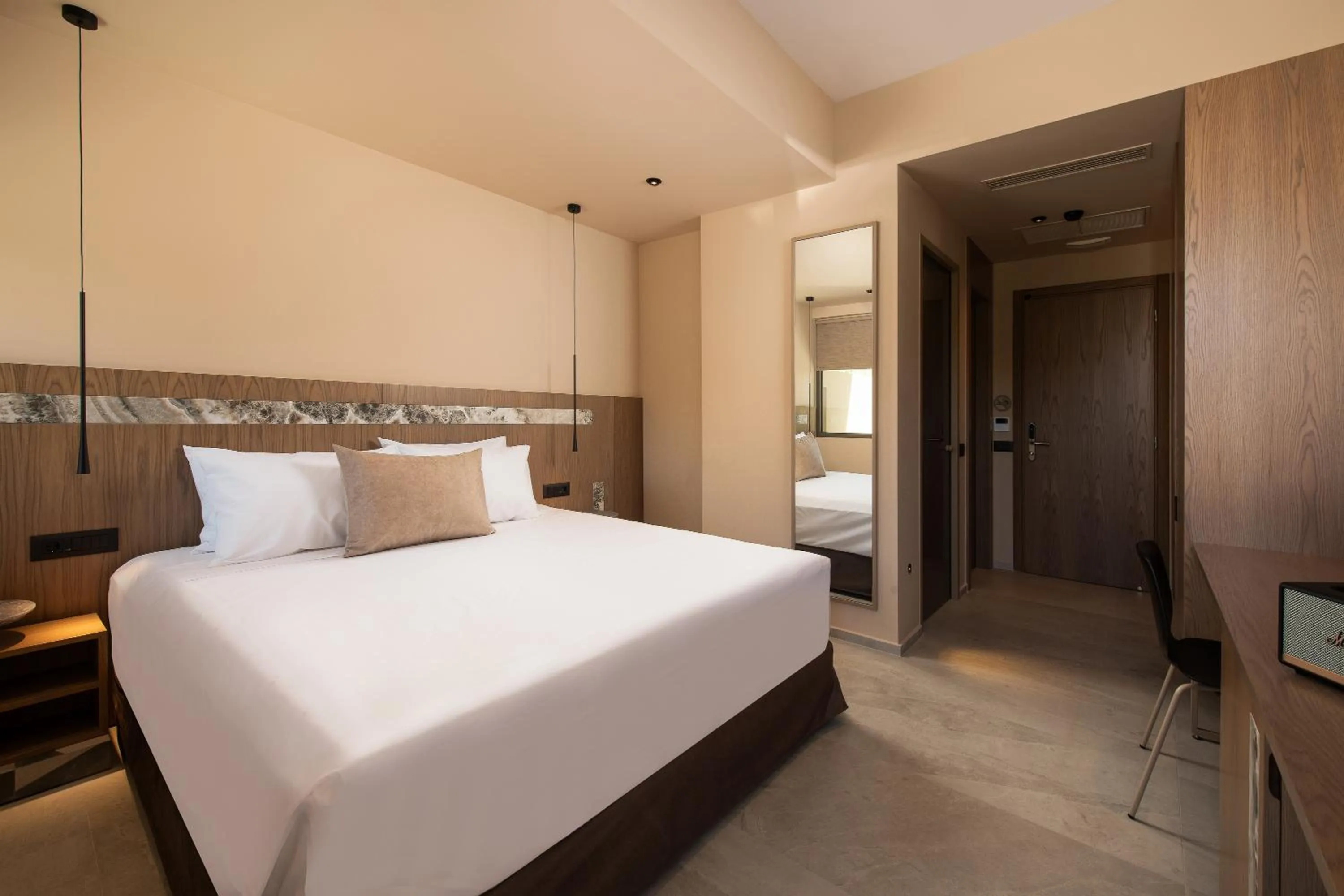 Bed in Cosmeen Lifestyle Boutique Stay