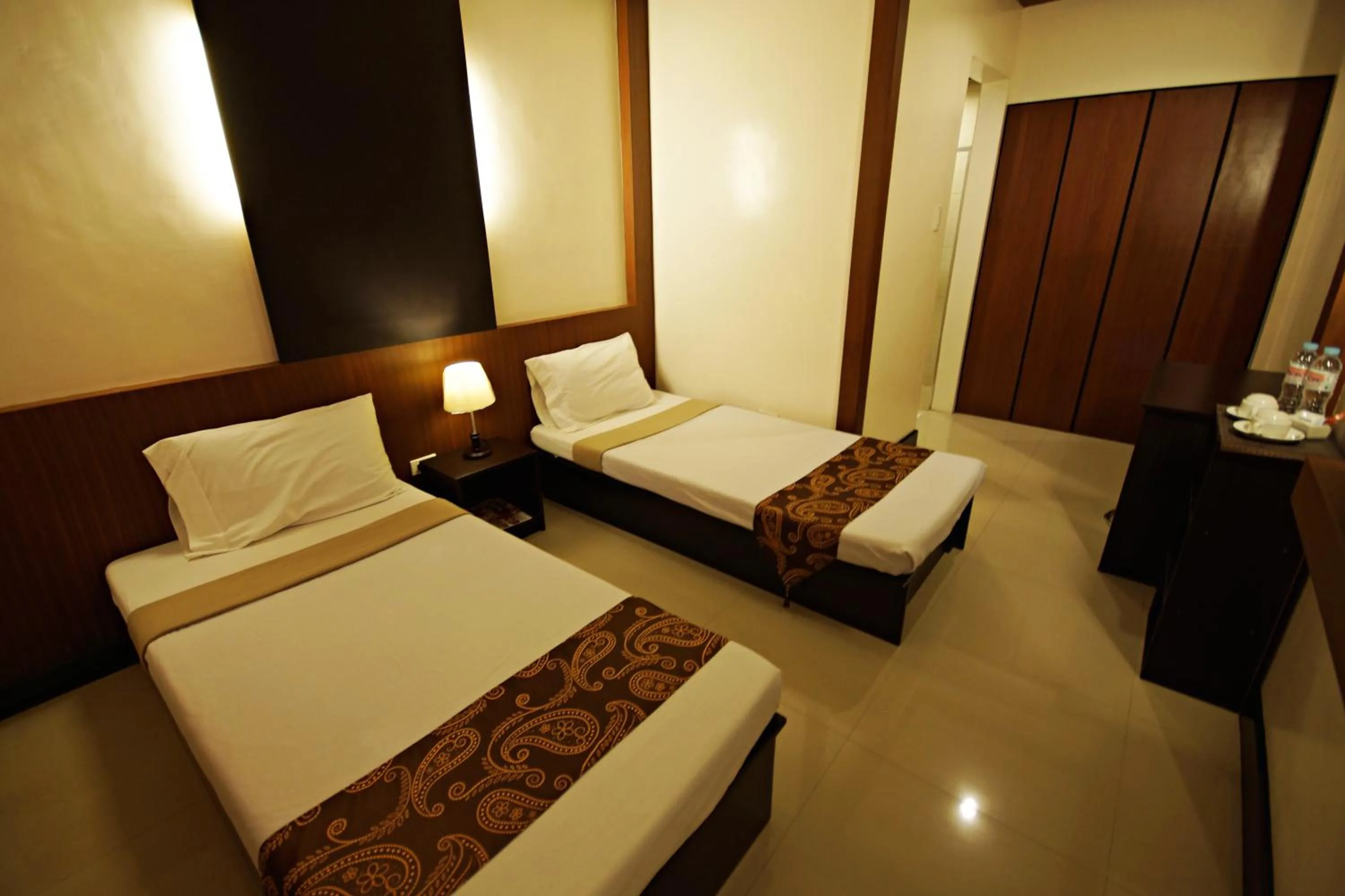 Photo of the whole room, Bed in Pacific Palm Suites Davao powered by Cocotel