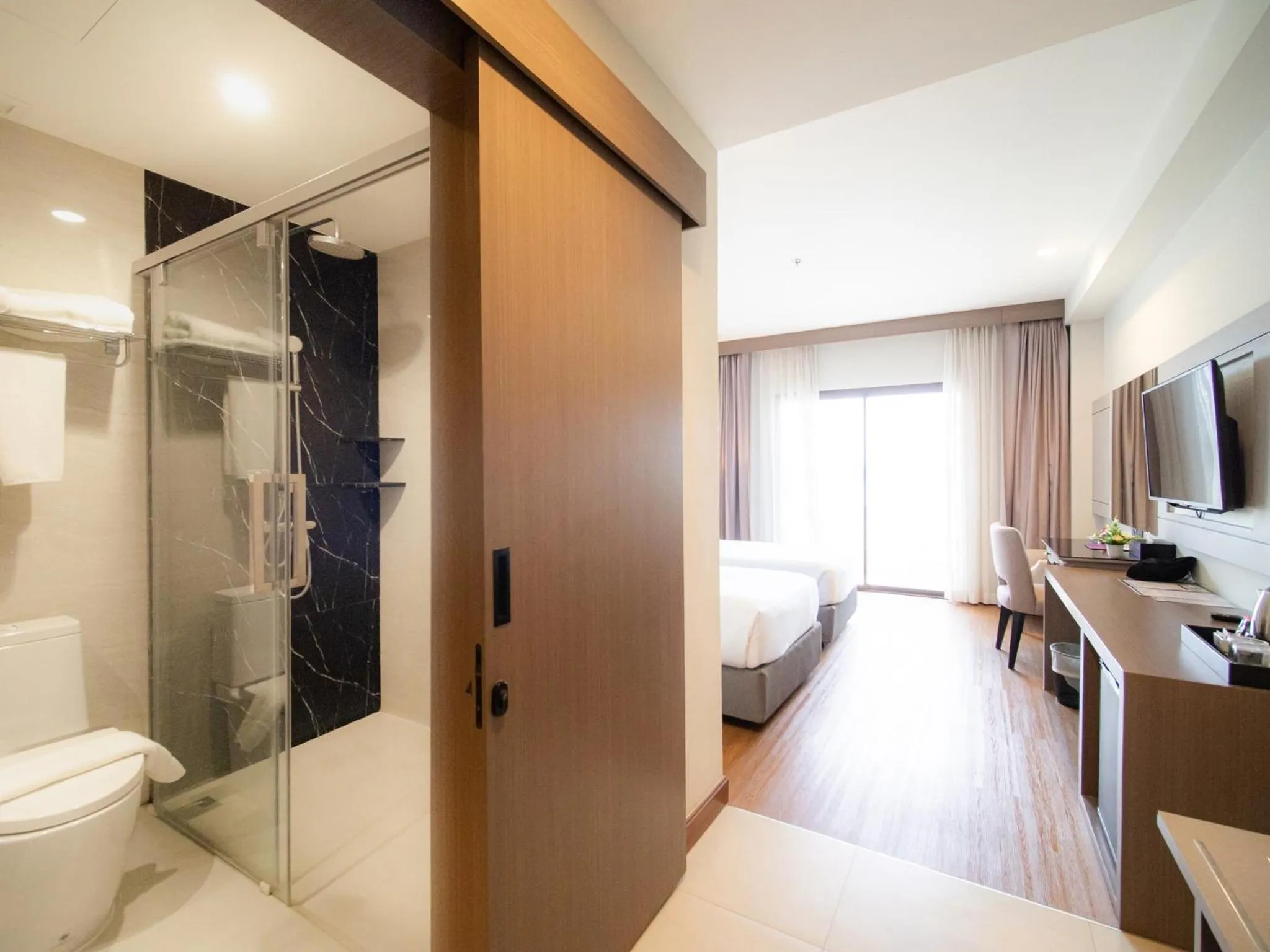 Bathroom, Bed in Fortune River View Hotel Nakhon Phanom