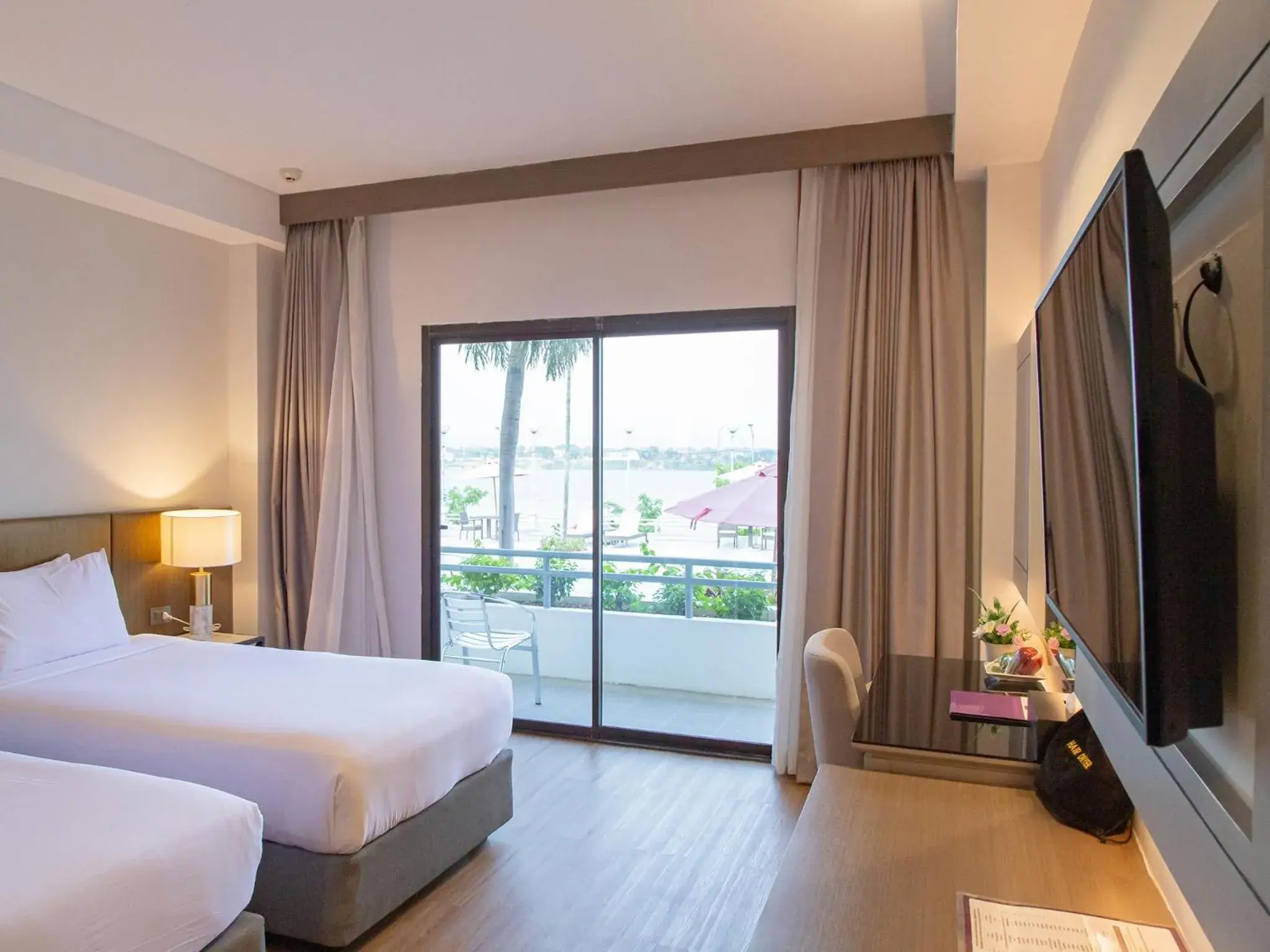 Twin Room with Pool View in Fortune River View Hotel Nakhon Phanom Twin Room with Pool View in Fortune River View Hotel Nakhon Phanom