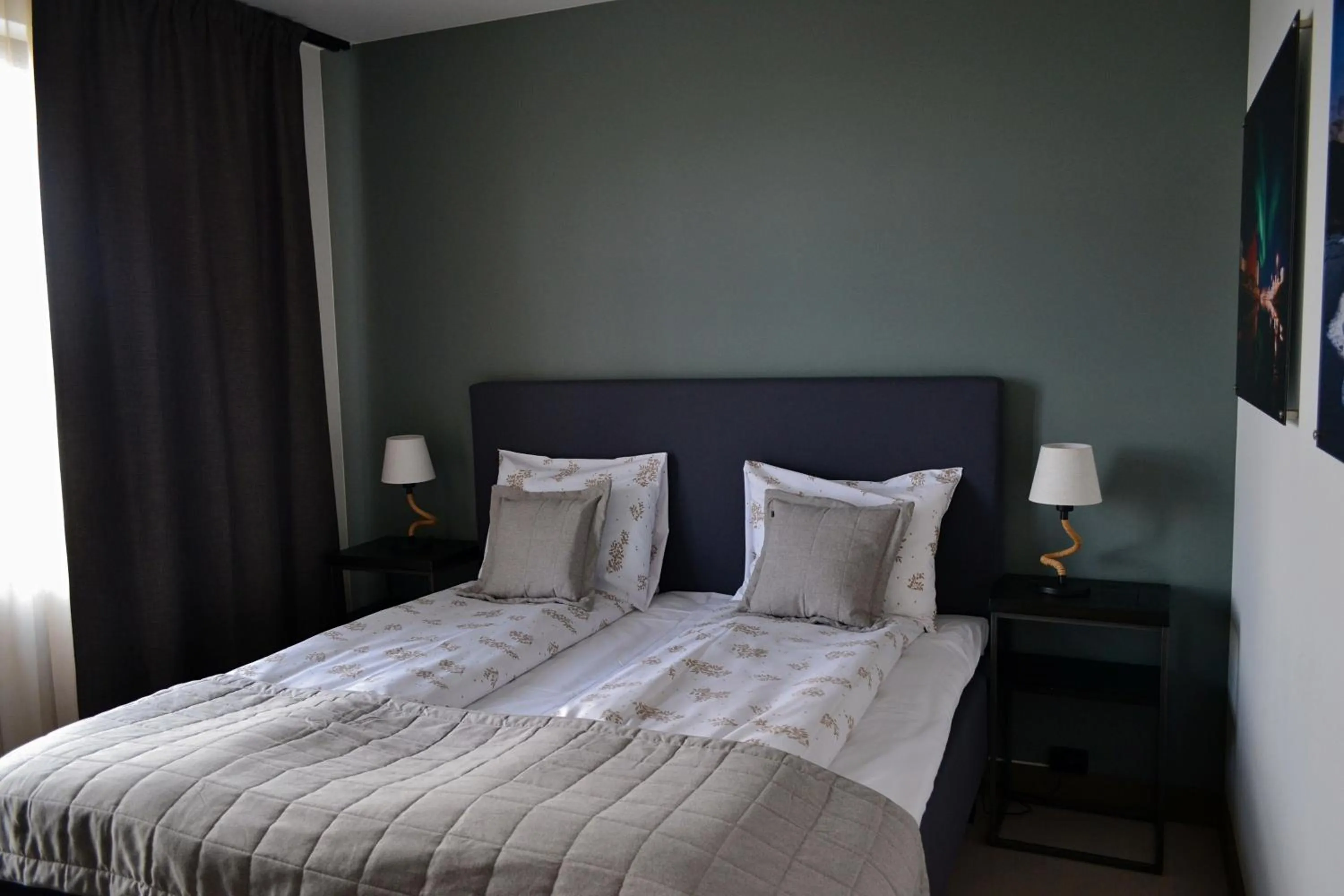 Bed in Andenes Suitehotel