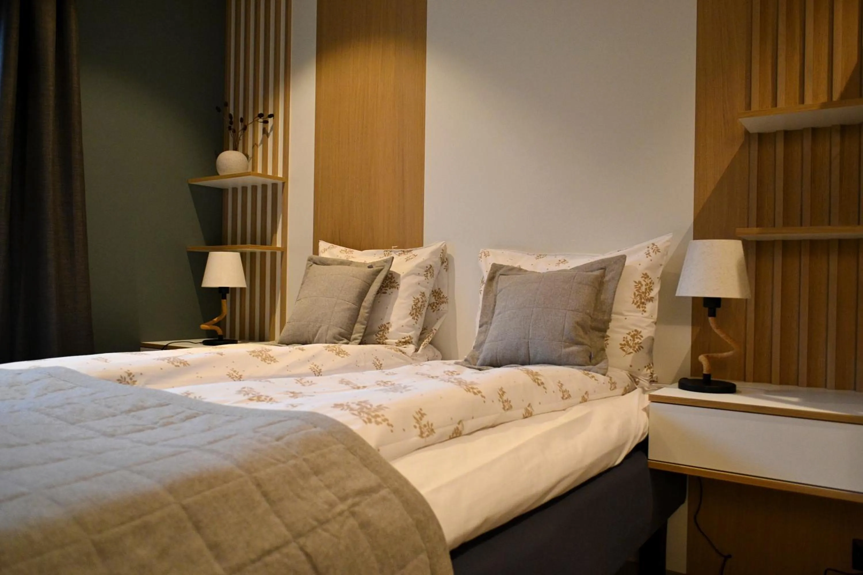 Bed in Andenes Suitehotel