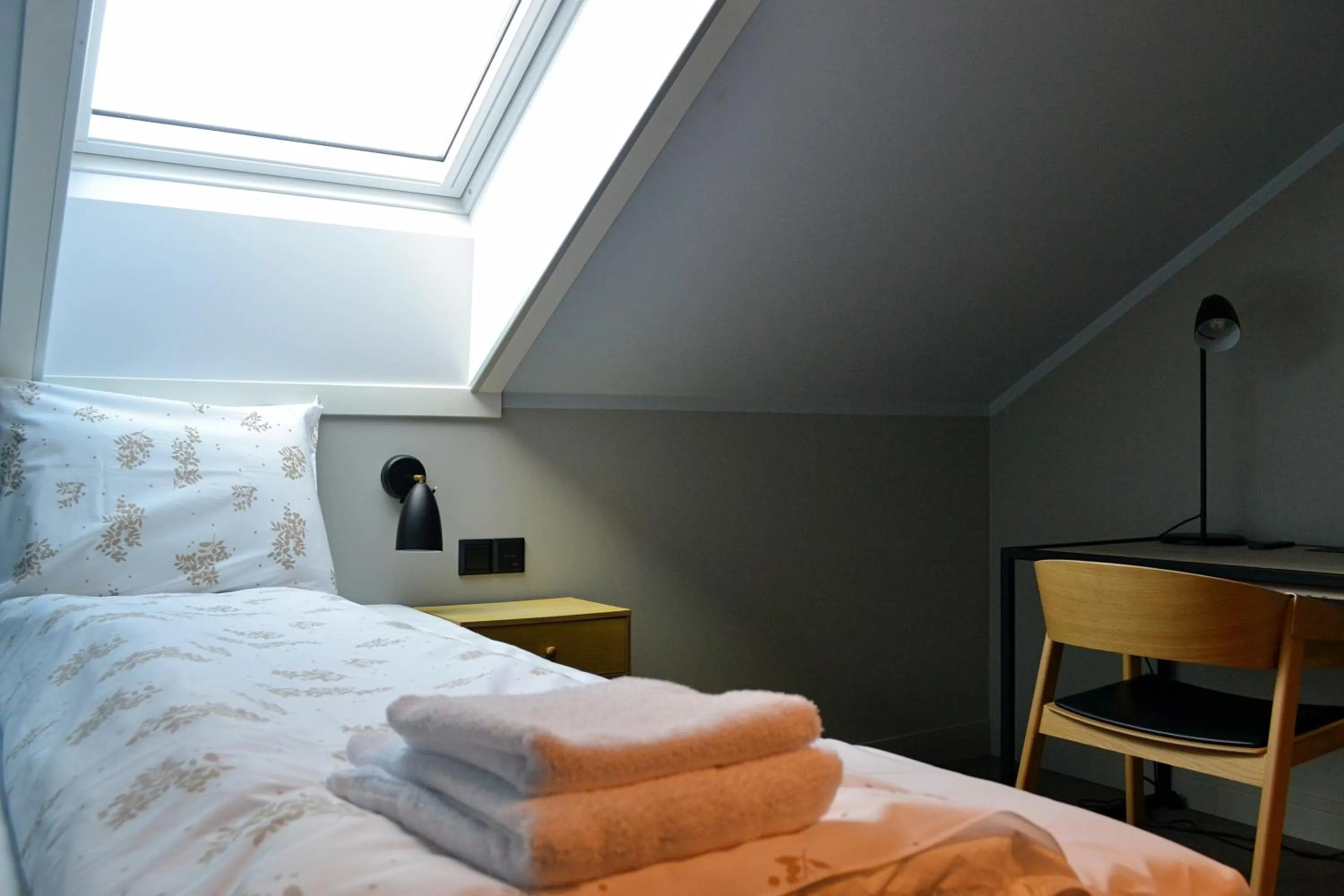 Bed in Andenes Suitehotel