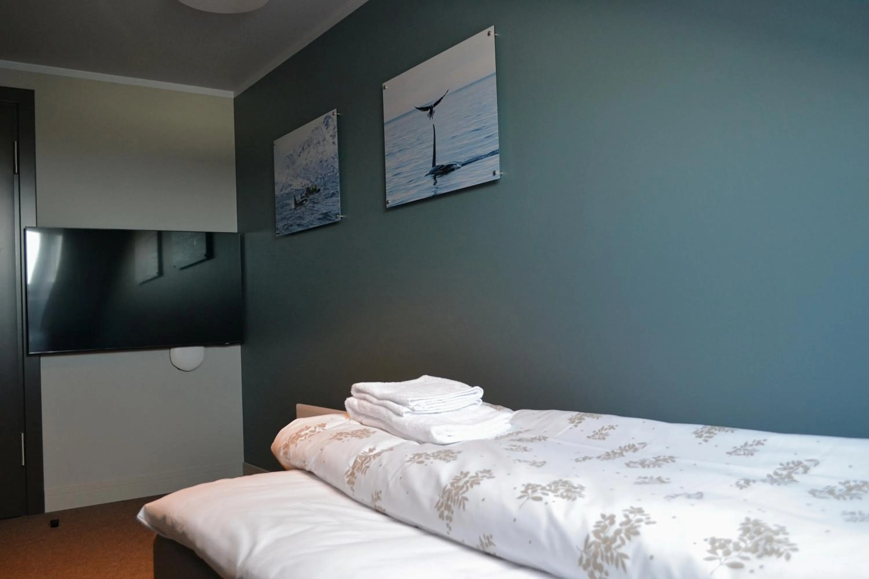 Bed in Andenes Suitehotel
