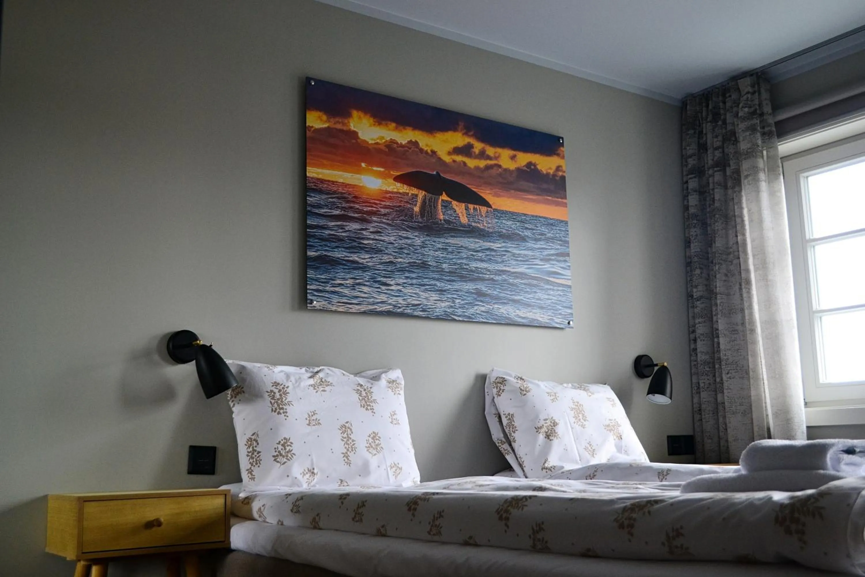 Bed in Andenes Suitehotel