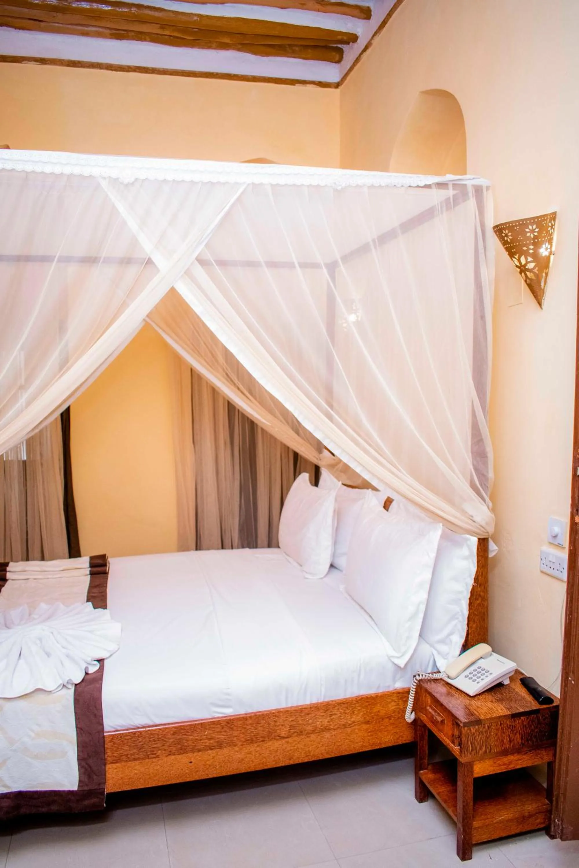 Bed in The Island Stone Town hotel