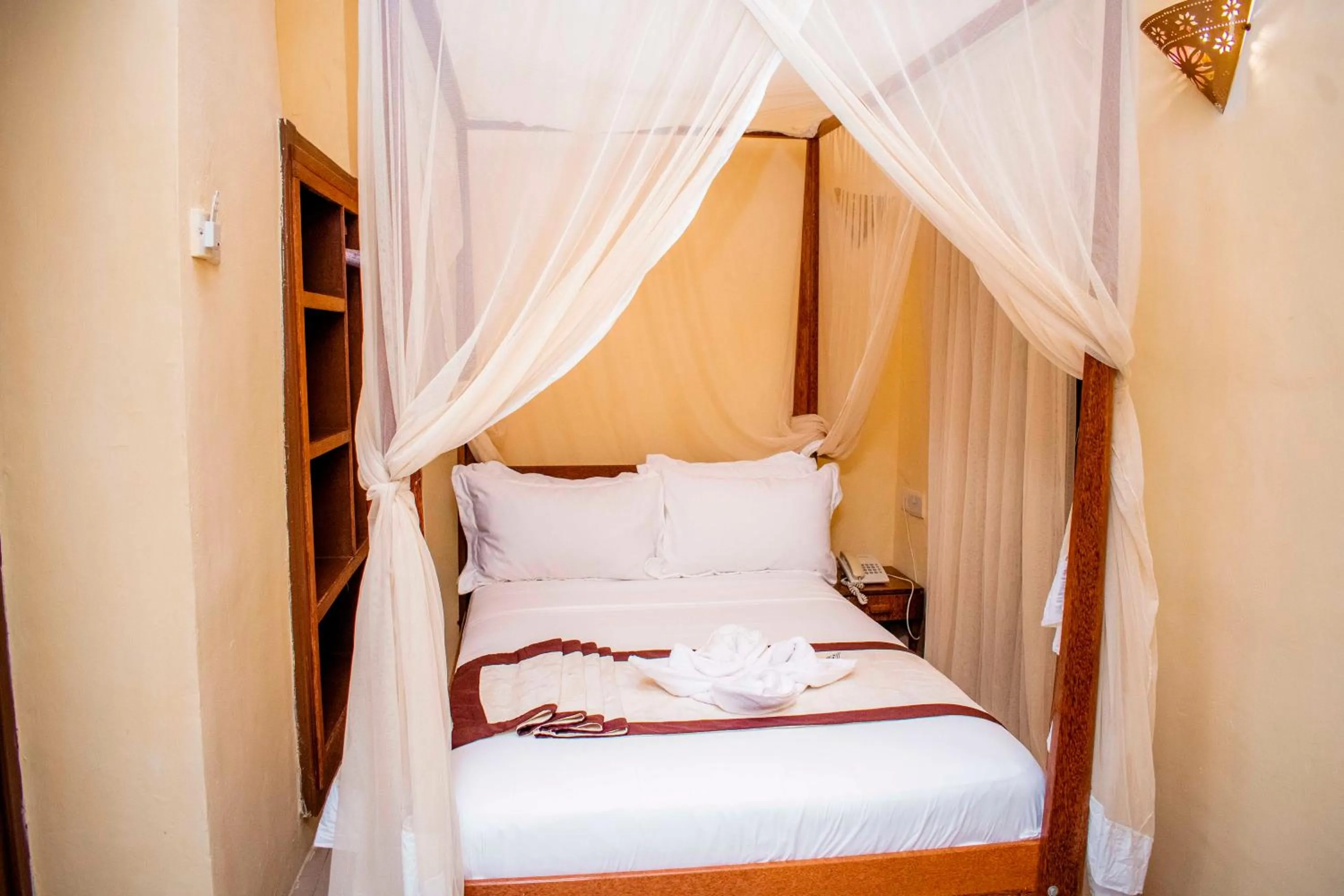 Bed in The Island Stone Town hotel