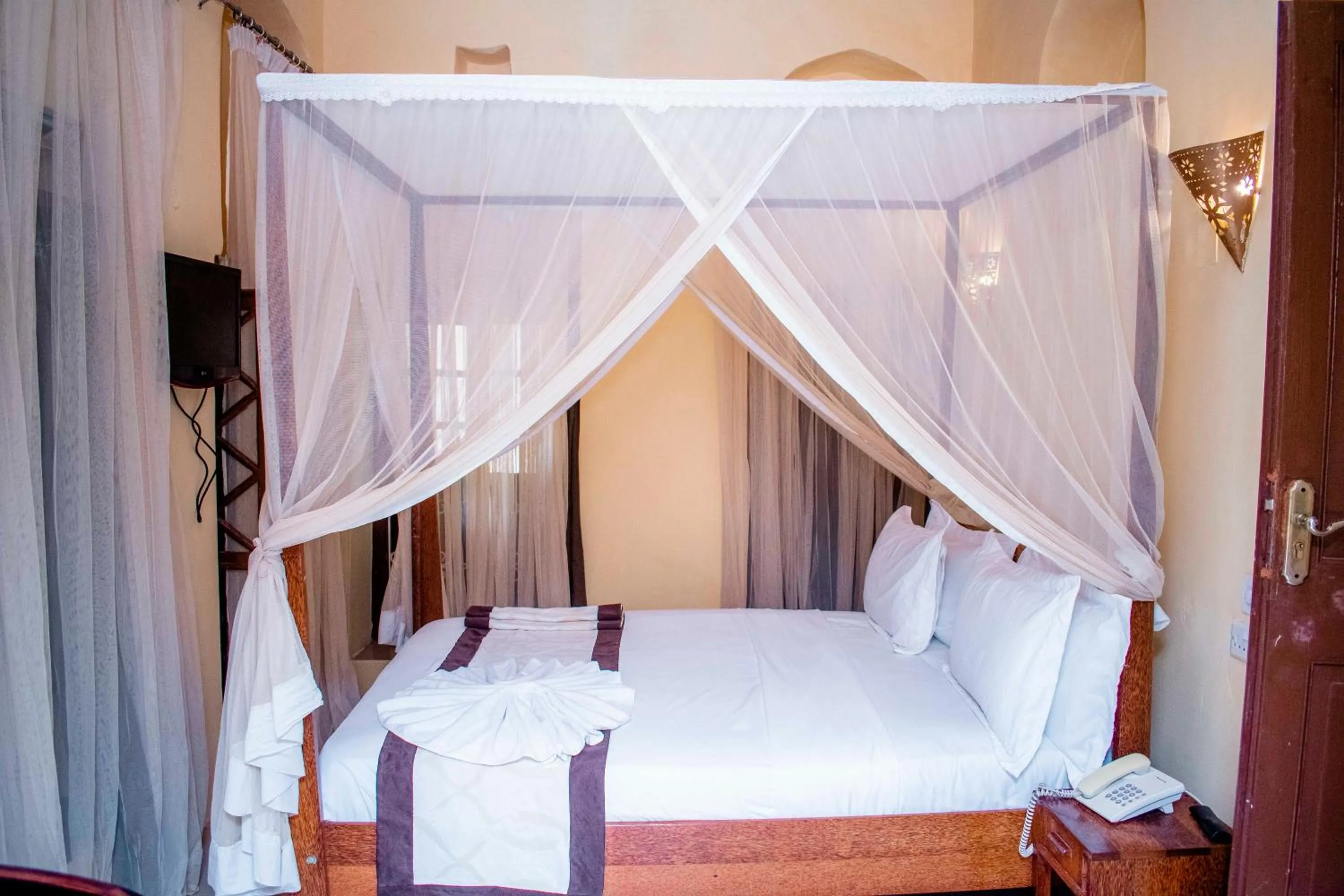 Bed in The Island Stone Town hotel