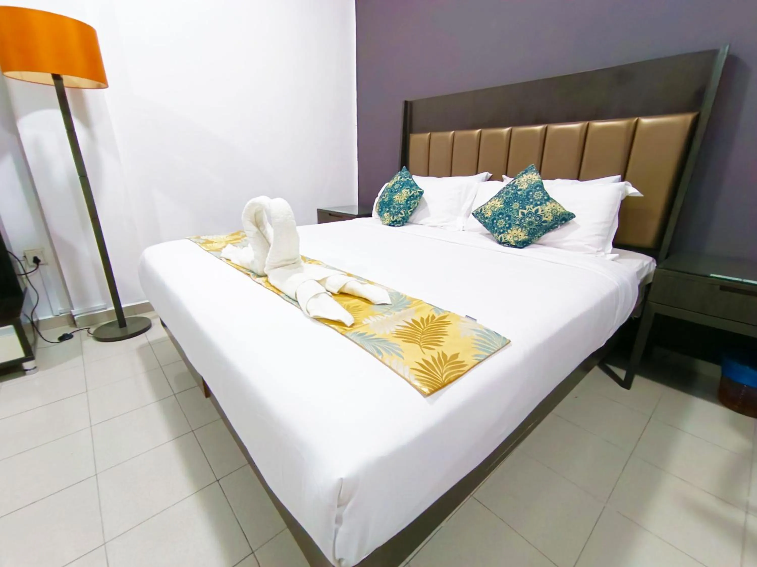 Bed in Salaam Suites Hotel