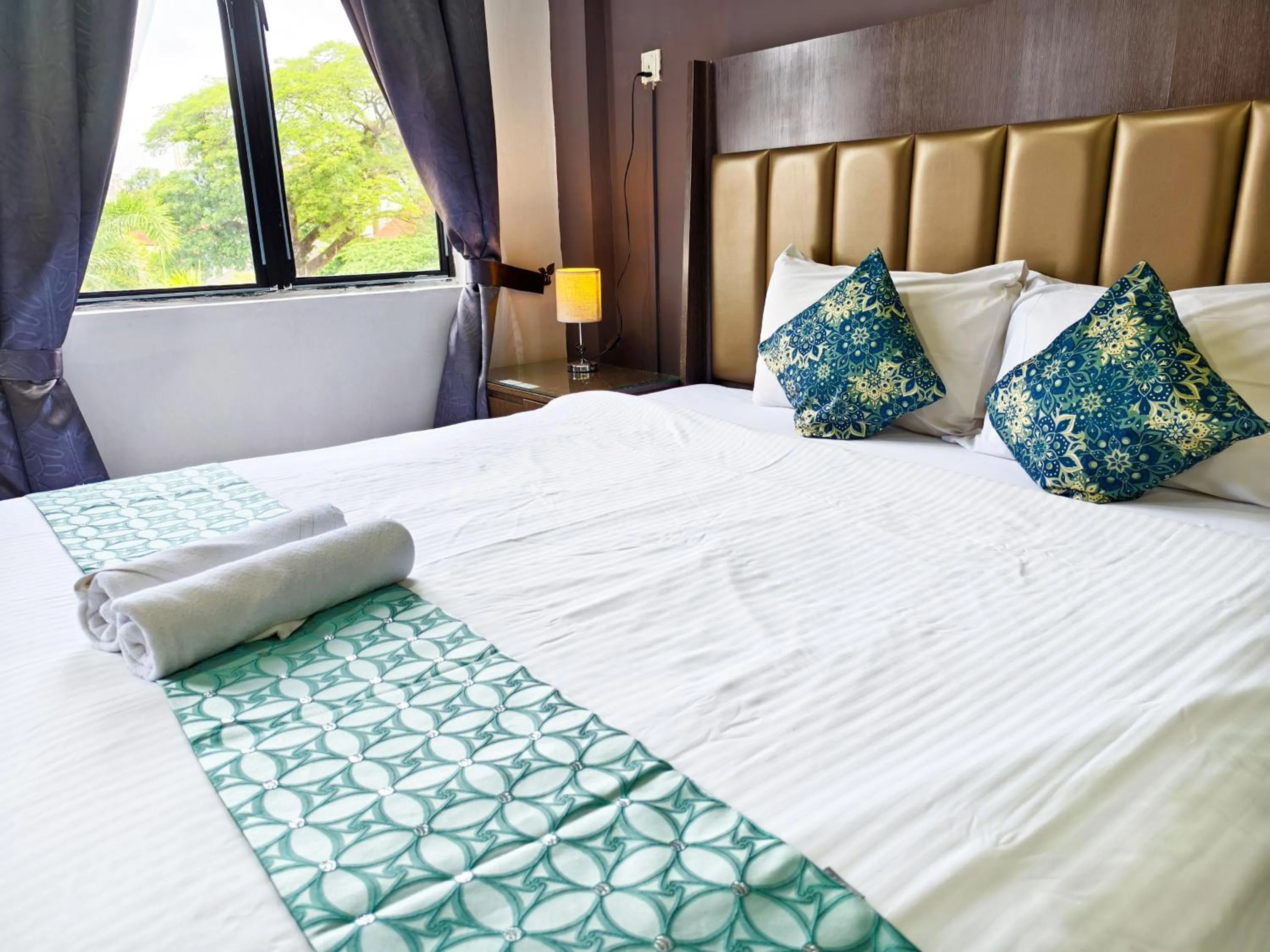 Bed in Salaam Suites Hotel